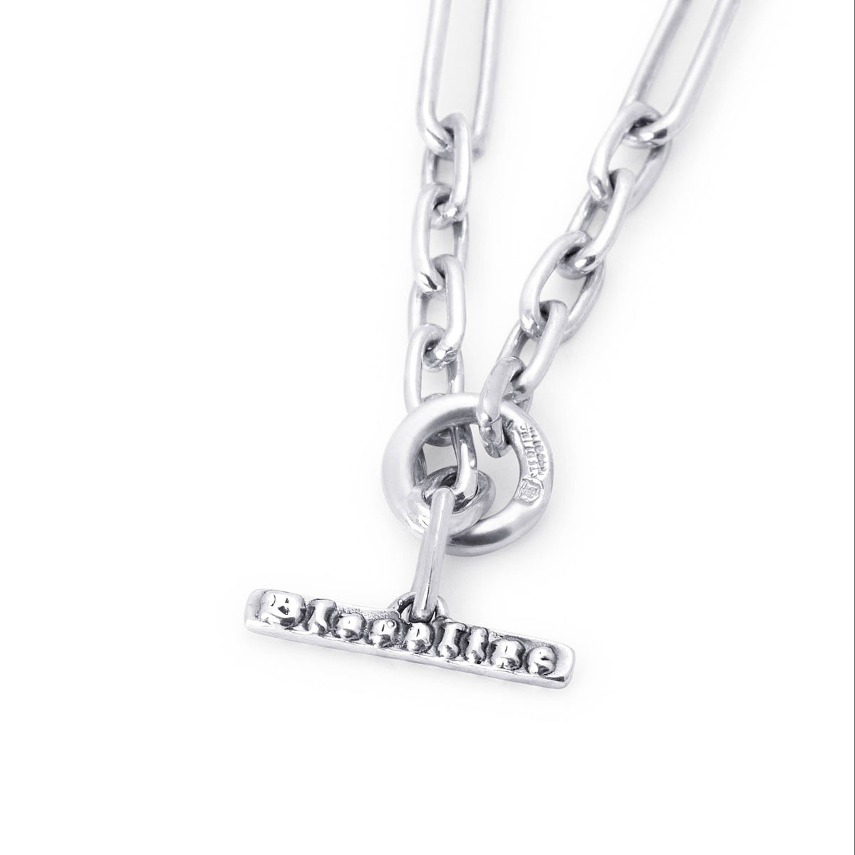 A silver-toned necklace featuring a flat paperclip chain, a circular ring connector, shown on a plain white background.