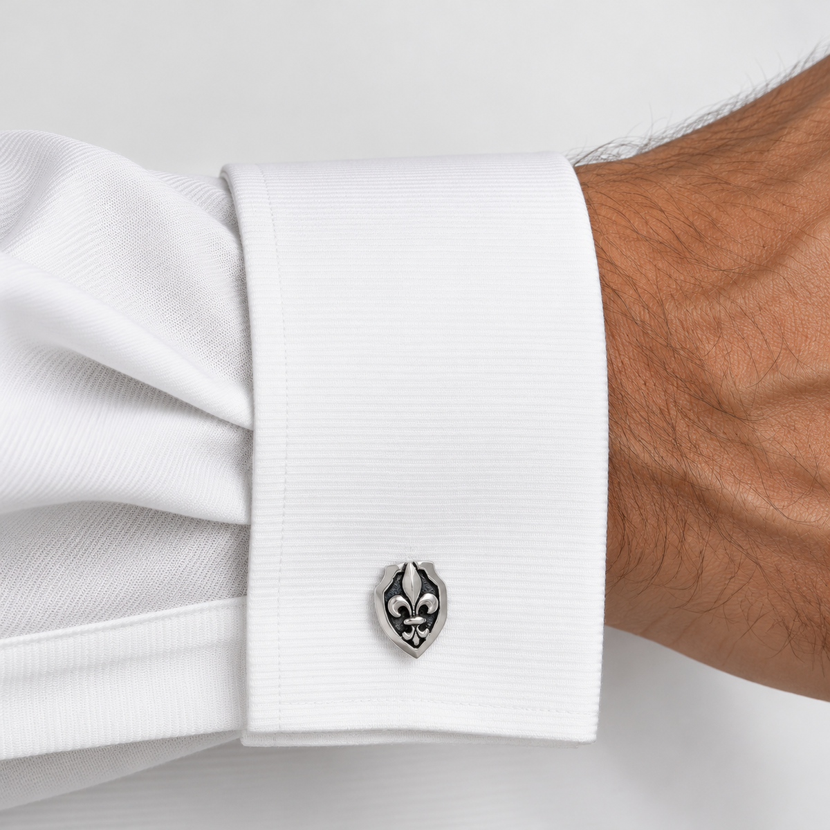 Bloodline Fleur de is shield cufflinks on a men's white shirt