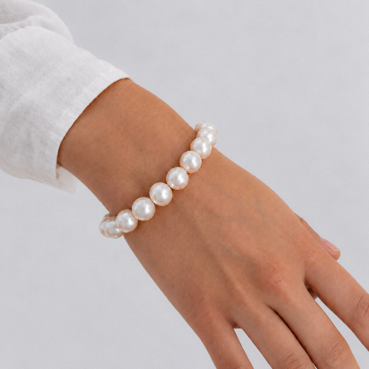 women's classic white pearl sterling silver bracelet worn on wrist