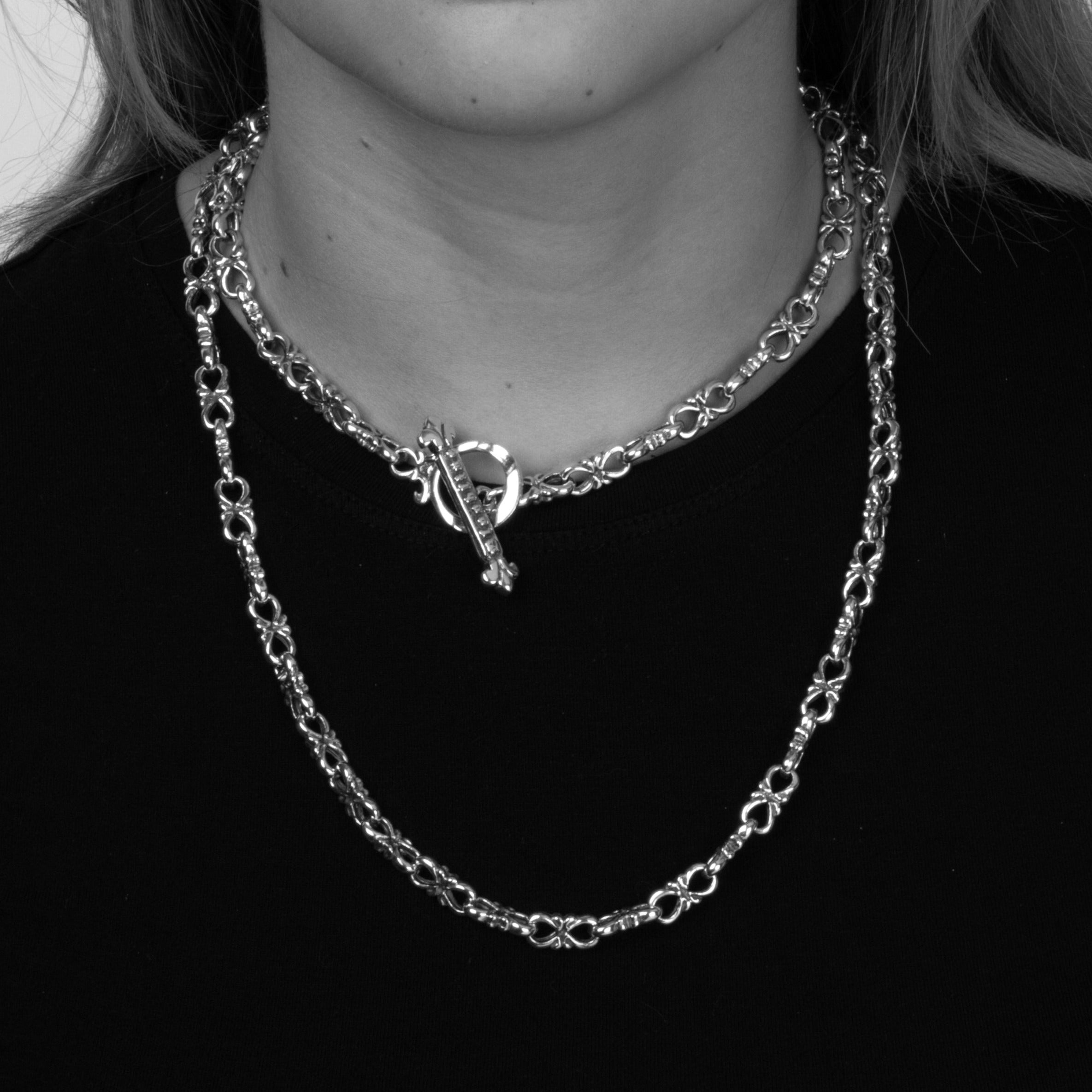 Solid Sterling Silver intricate heavy link chain shown on a model