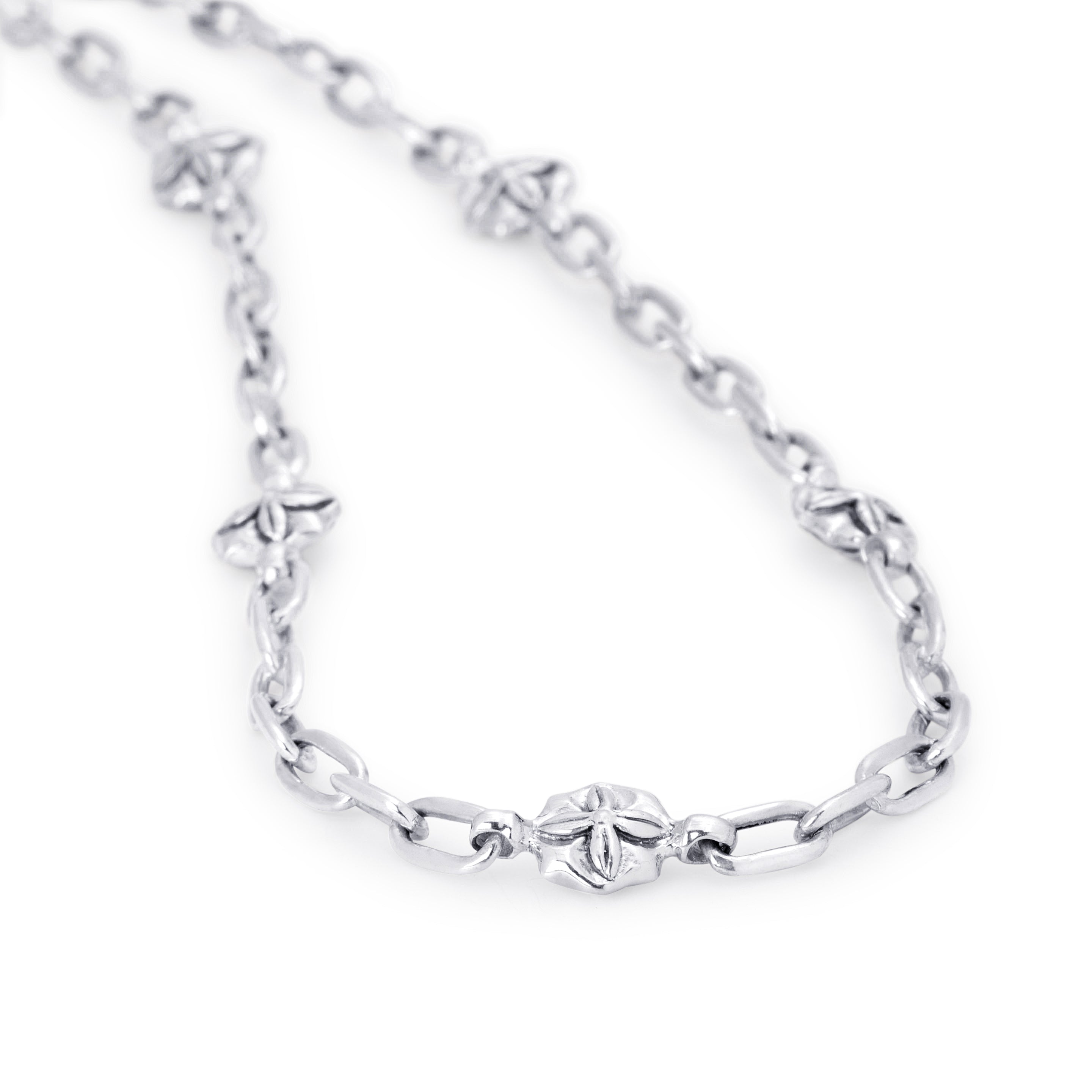 A silver-toned chain necklace featuring a central clover-shaped link and smaller clover motifs spaced along the chain, shown on a plain white background.
