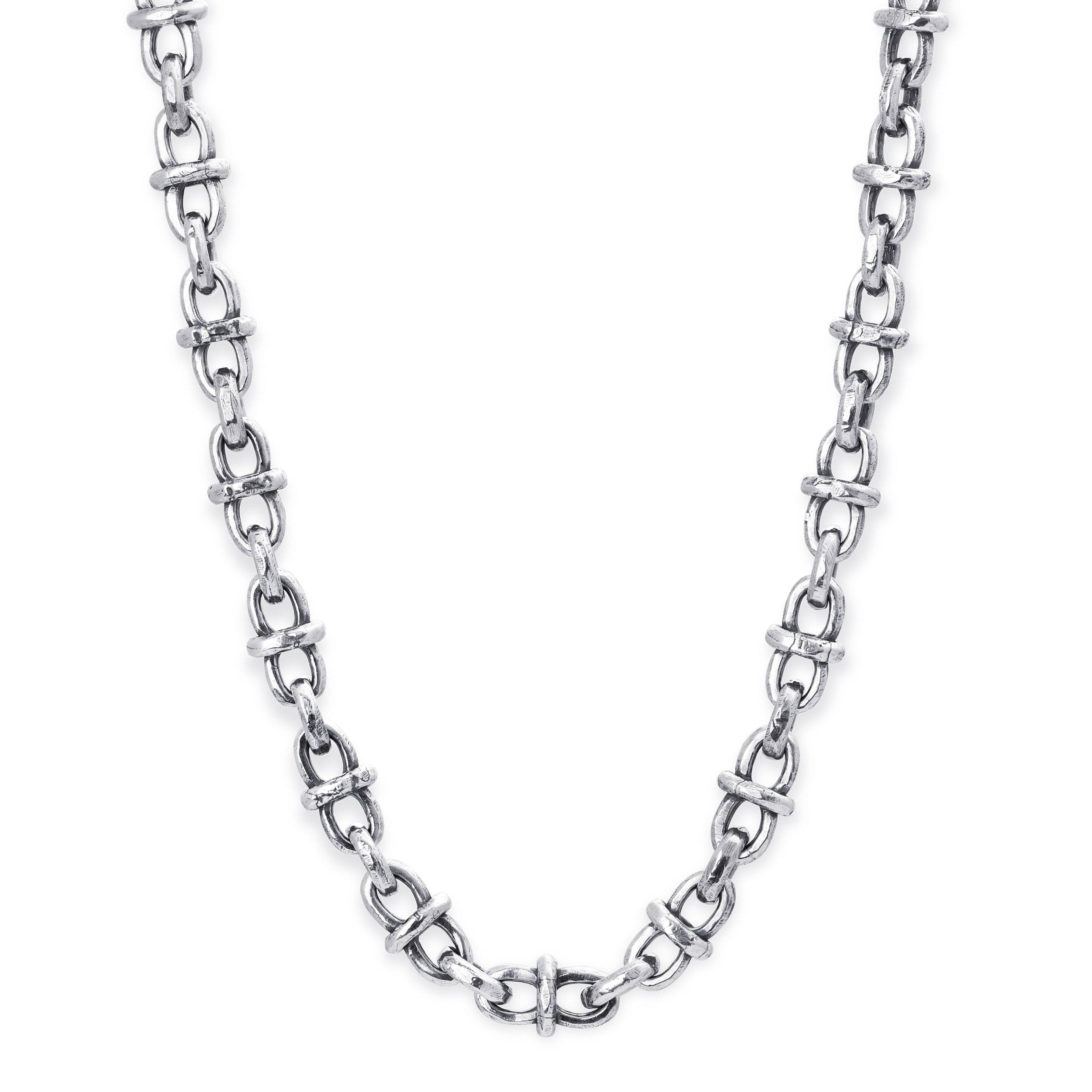 A silver-toned metal chain necklace with a distinctive interlocking link design, displayed against a solid white background.