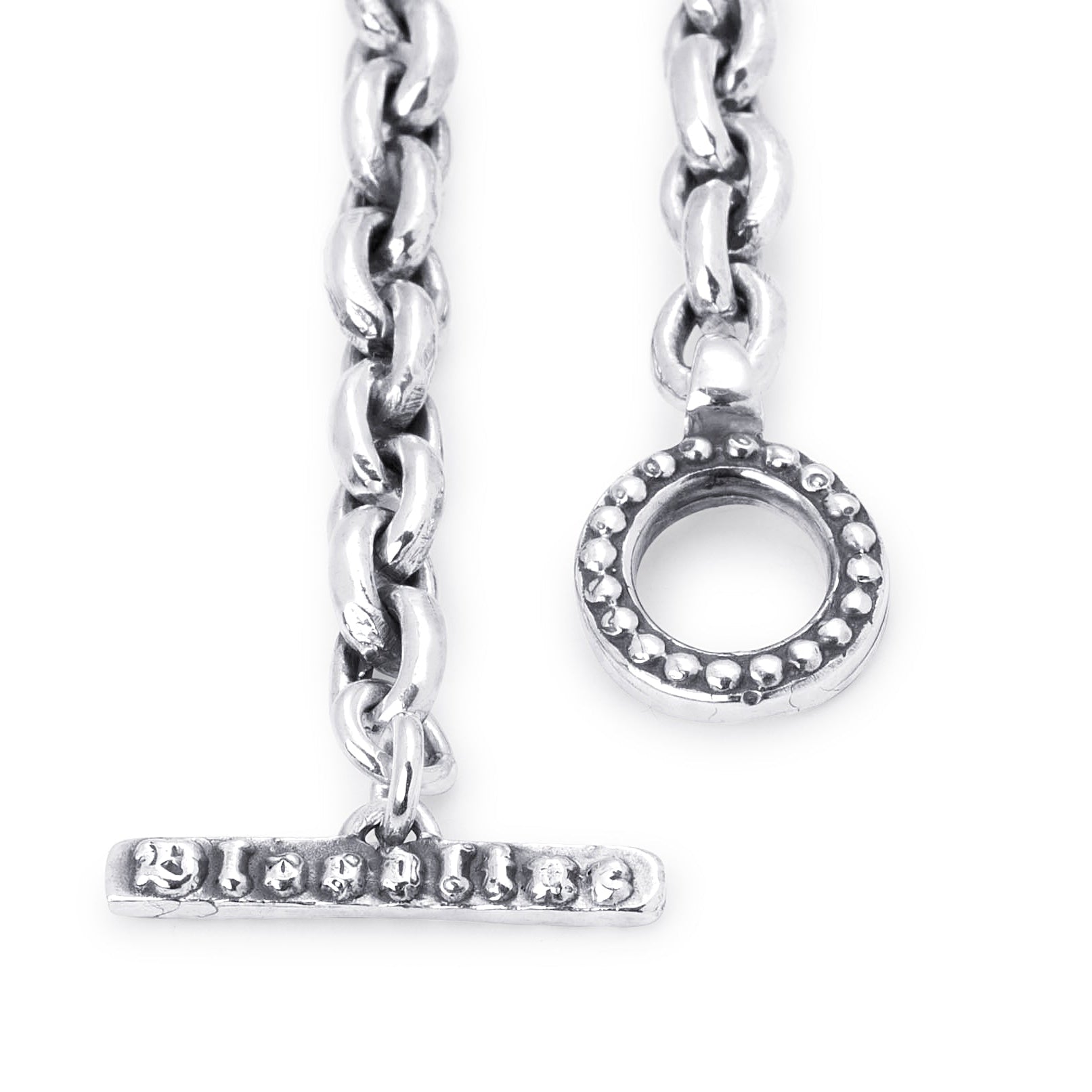 Silver-tone toggle clasp charm with a bar and ring closure, shown on a plain white background.