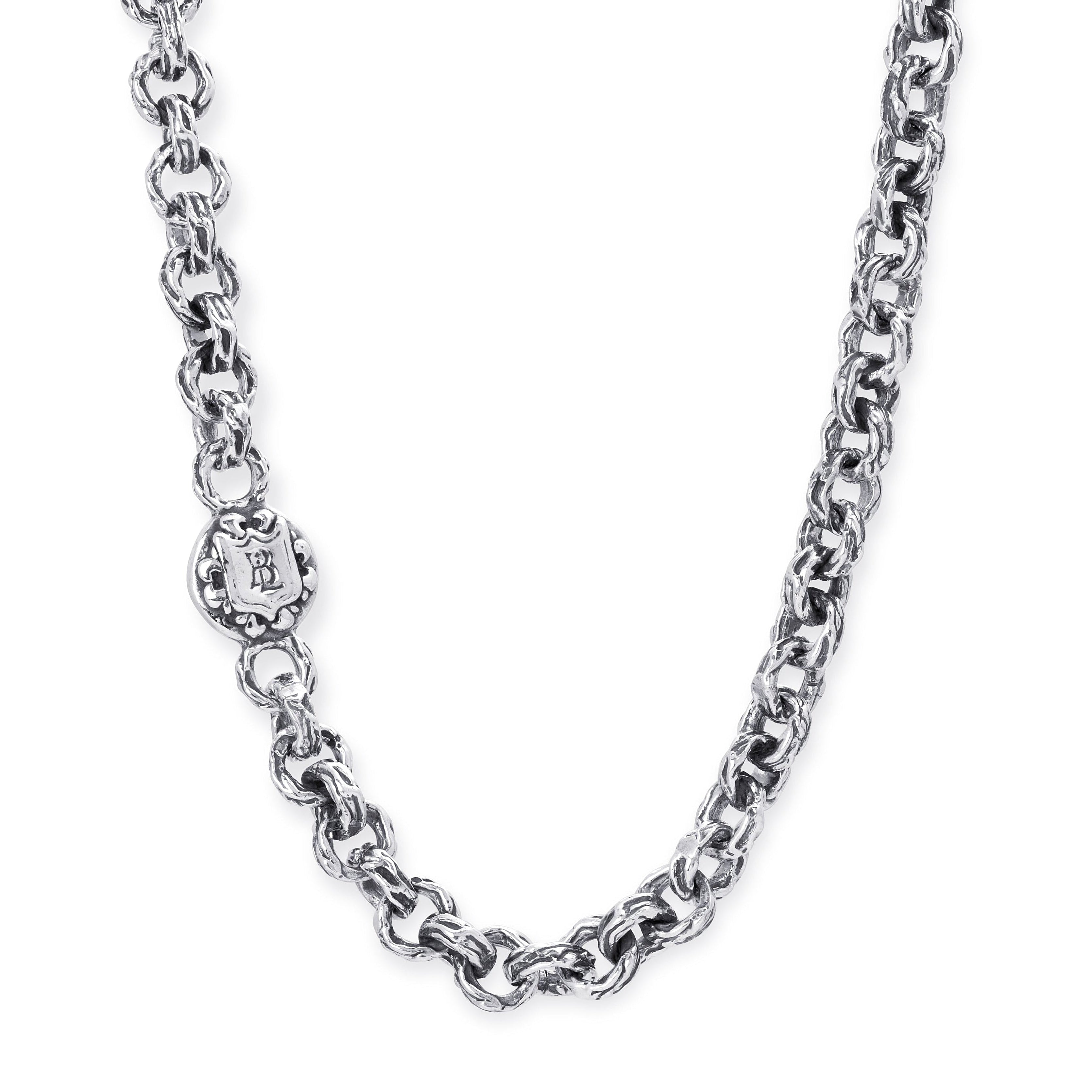 A close-up of a silver-toned chain necklace with a decorative clasp, shown against a plain white background.