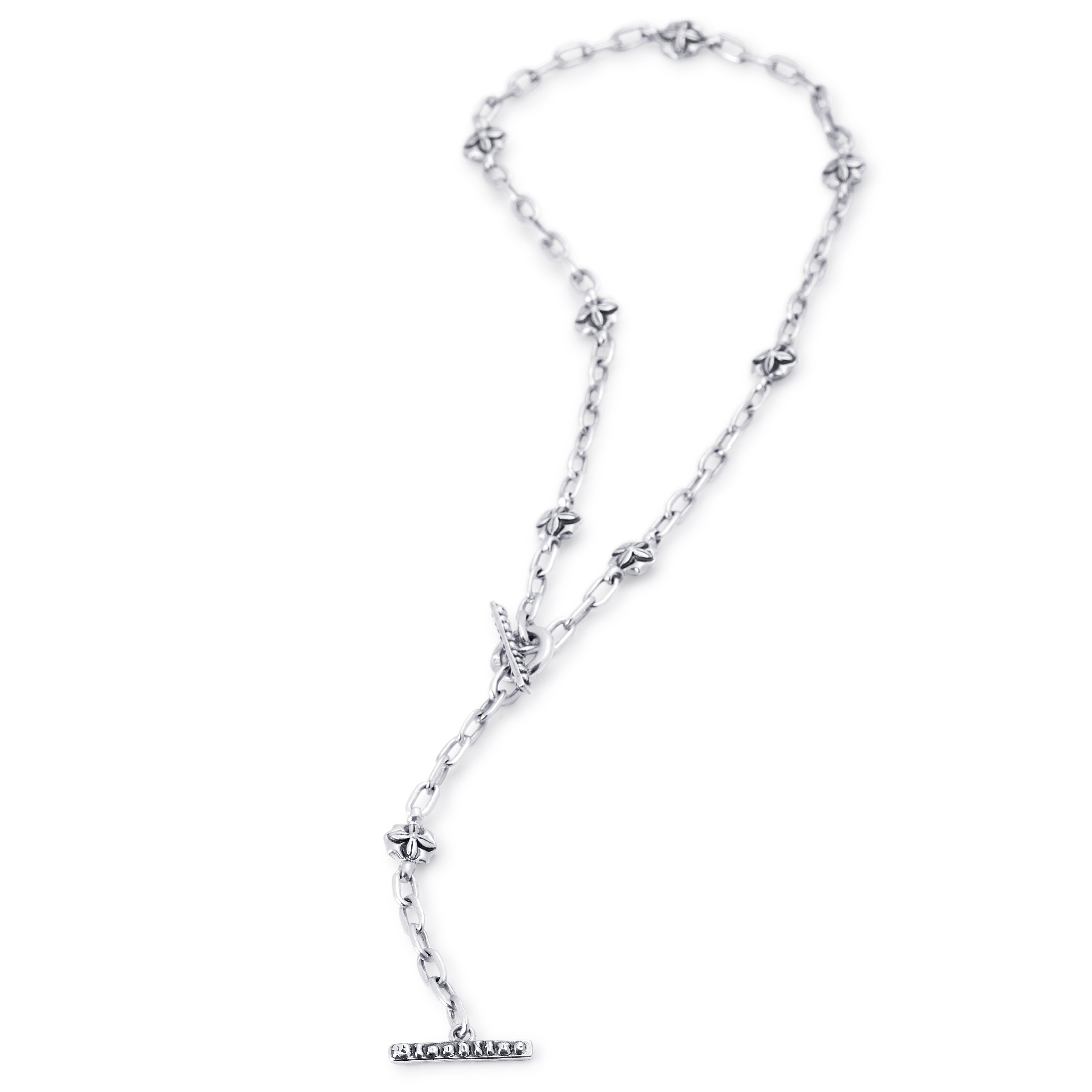 A silver-toned chain necklace featuring small star-shaped links and a T-bar clasp, displayed on a clean white background.