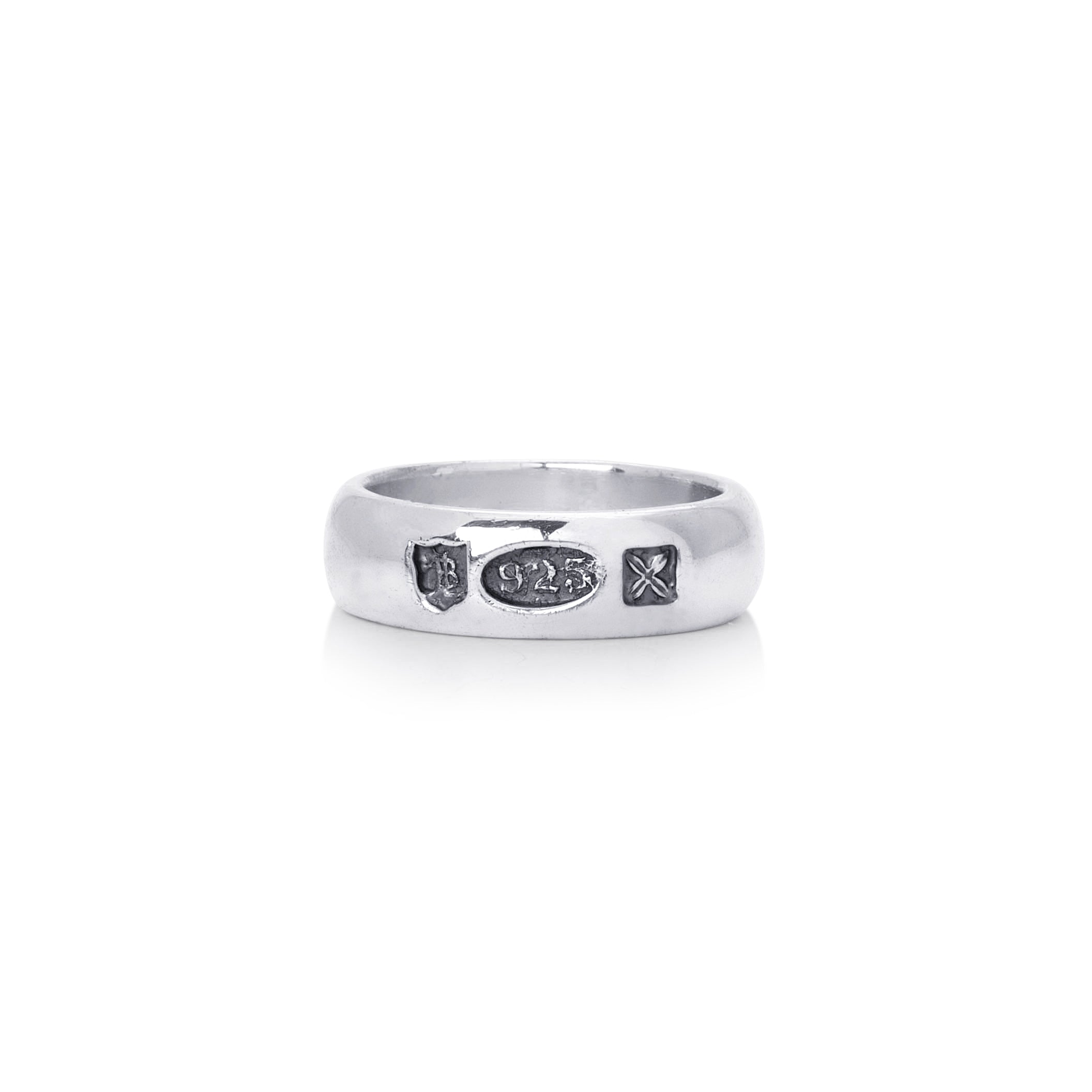 Mens sterling silver hallmark band, hallmarks stamped on ring. shown on a pain white background. 