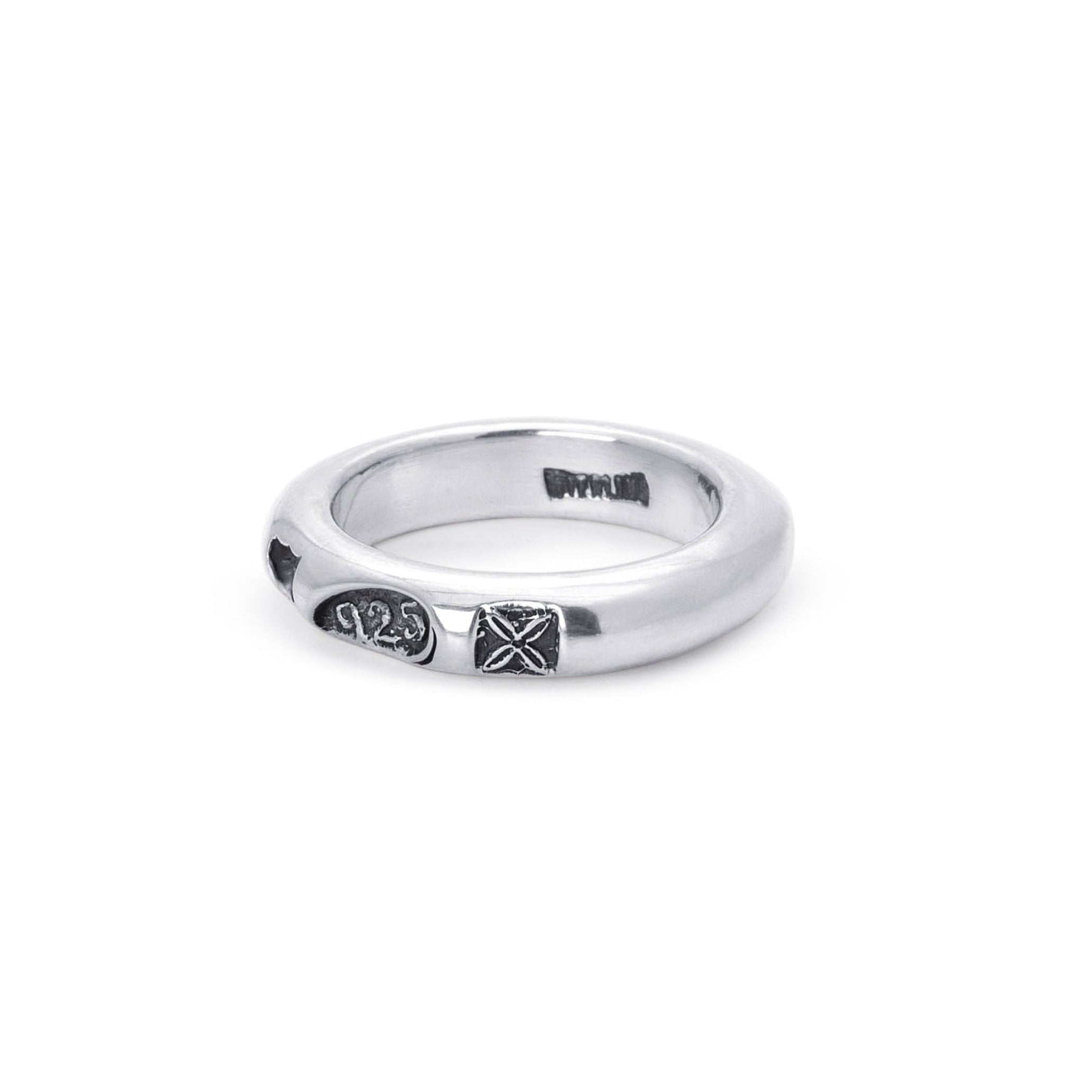 A silver band ring with blackened hallmark stamps, shown on a plain white background.
