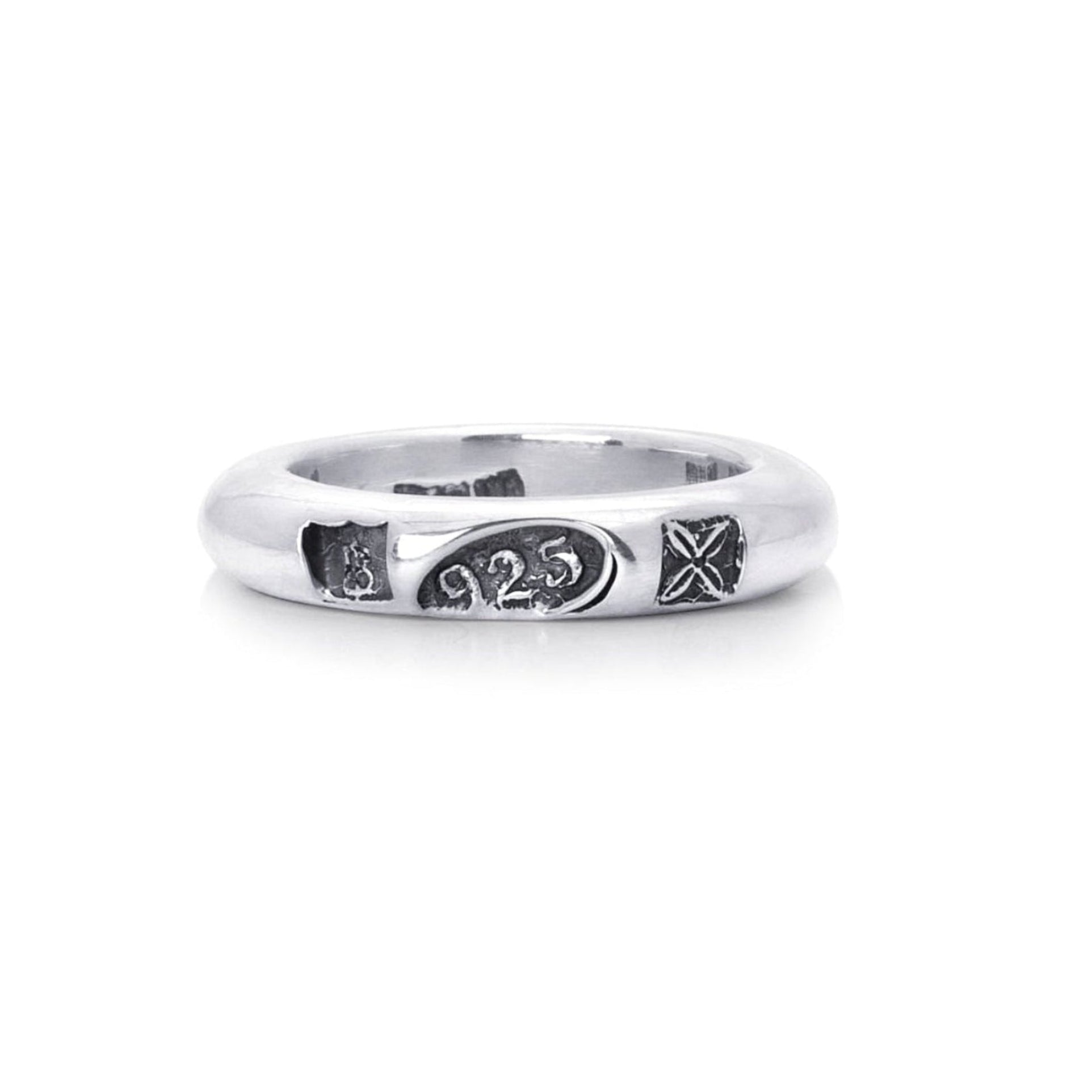 A silver band ring featuring engraved blackened hallmark stamps shown on a plain white background.