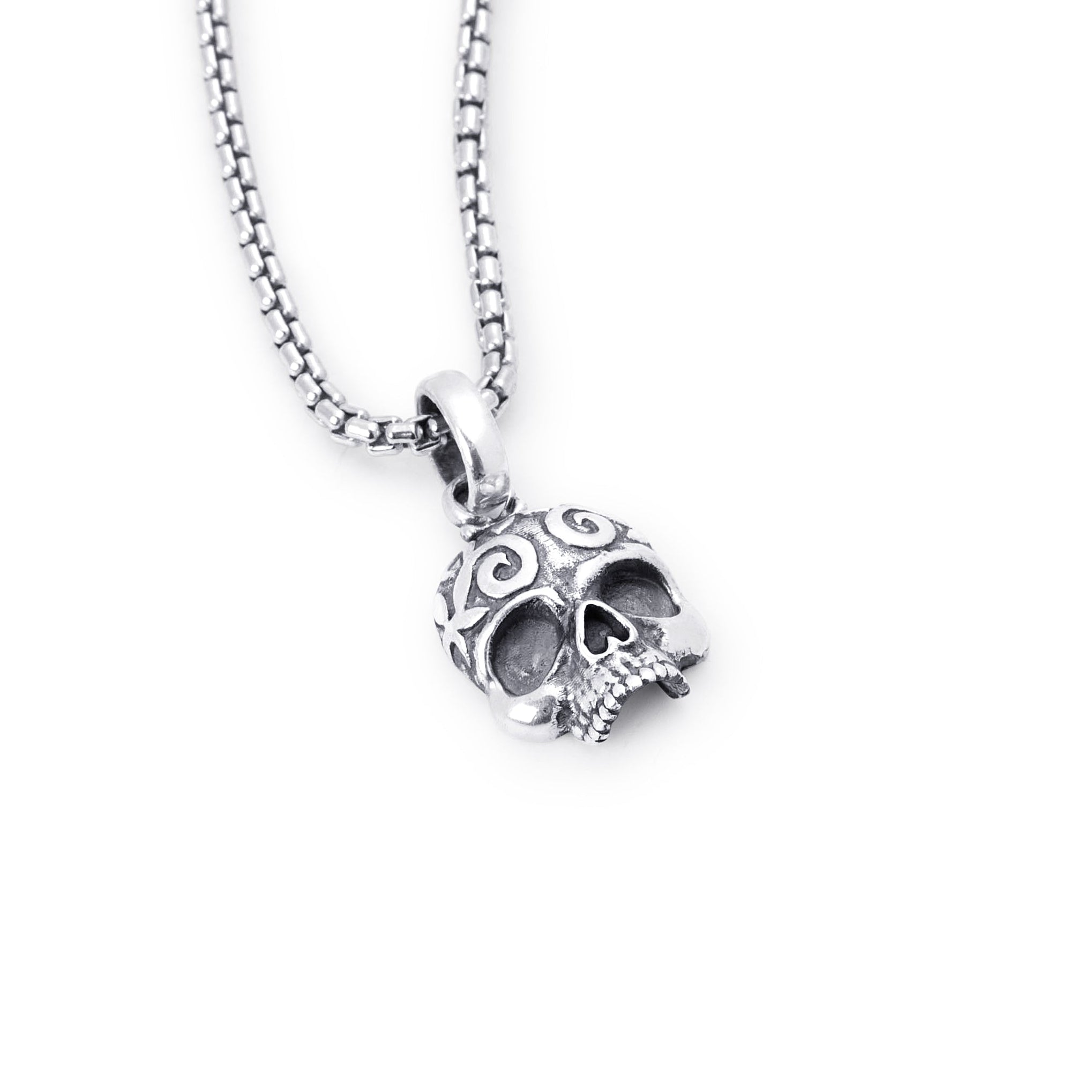 A sterling silver skull pendant with a detailed design, hanging from a rounded box chain against a plain white background.
