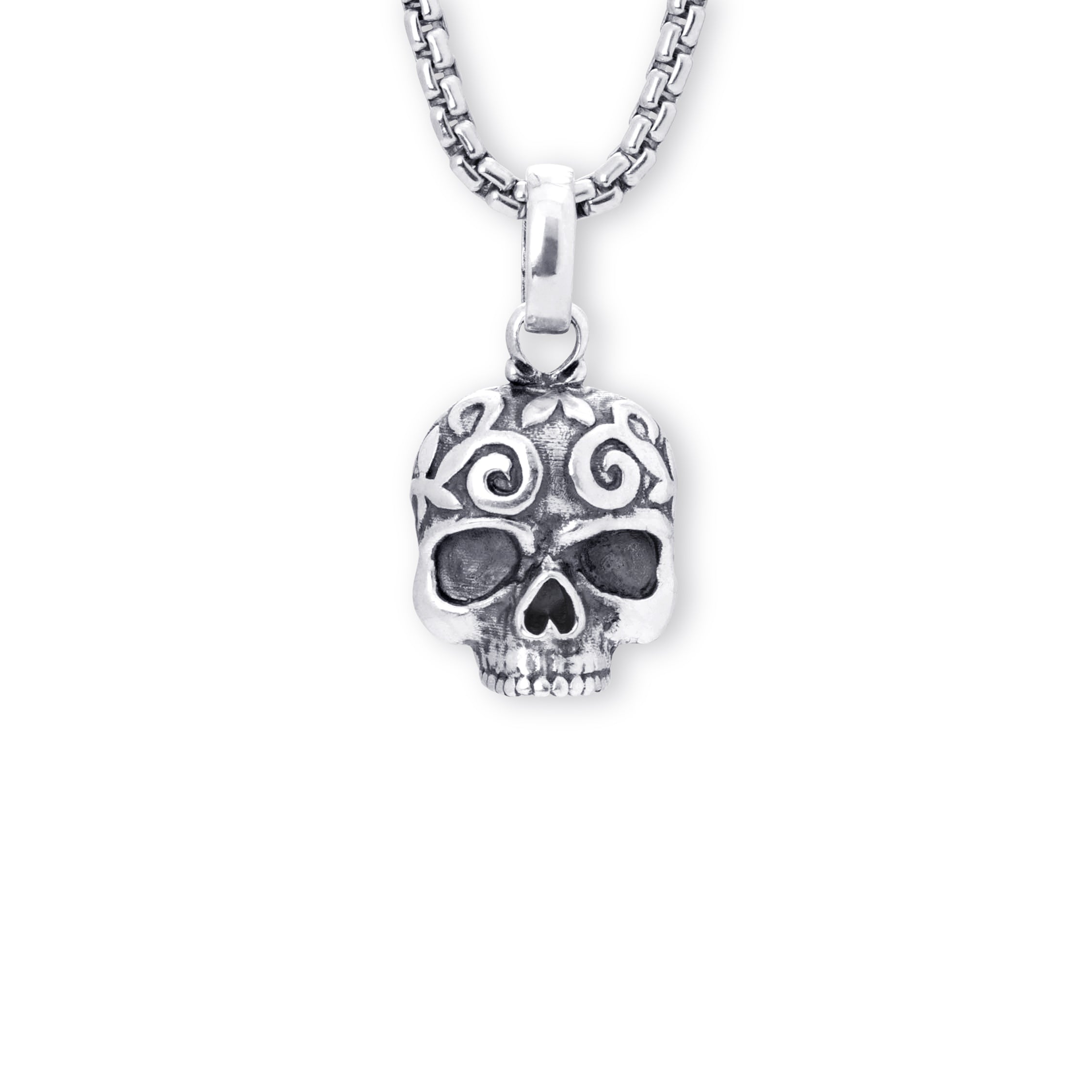 A silver skull pendant with intricate details on the forehead, hanging from a silver box chain against a plain white background.