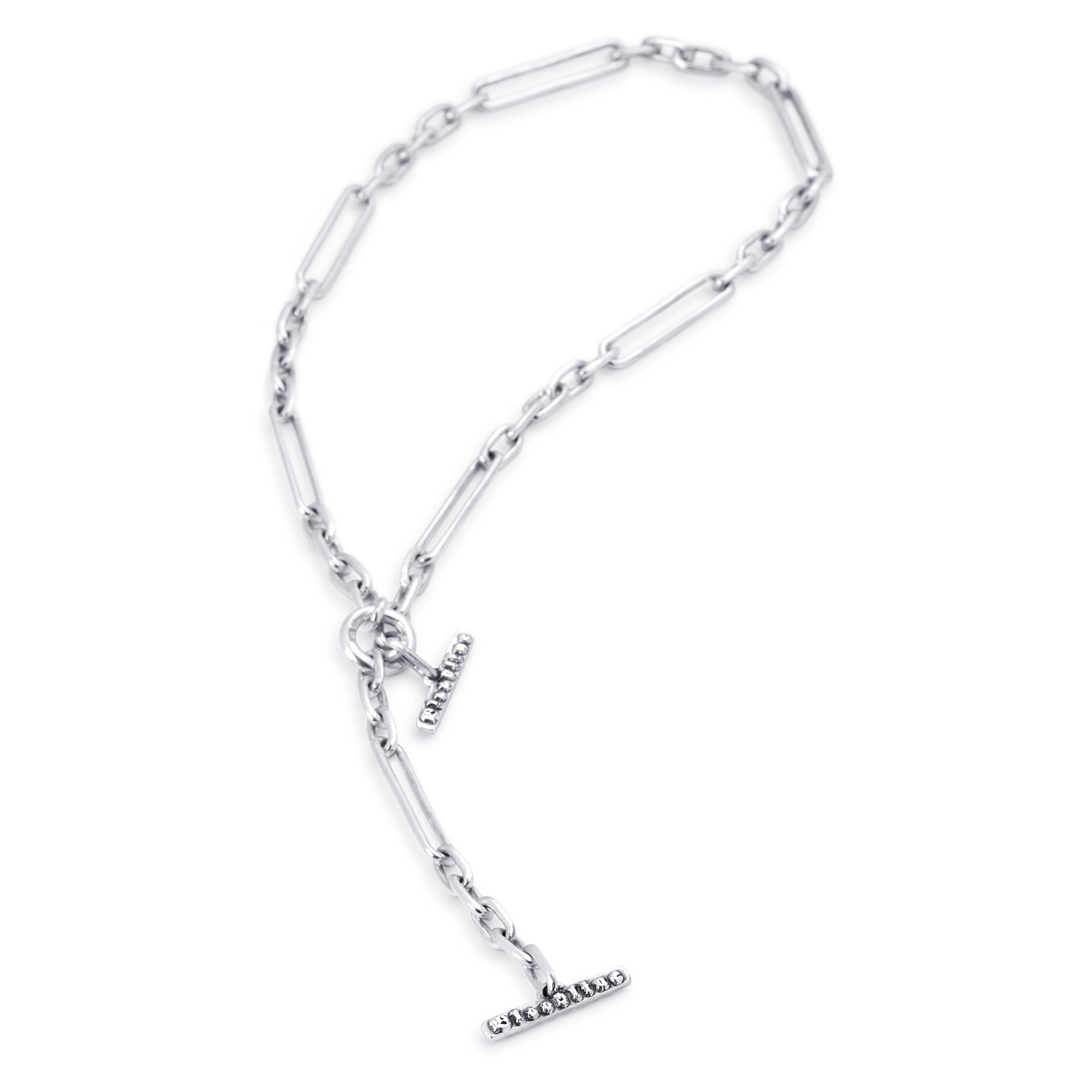 A silver-toned lariat chain necklace with a Bloodline T-bar clasp, shown on a plain white background.