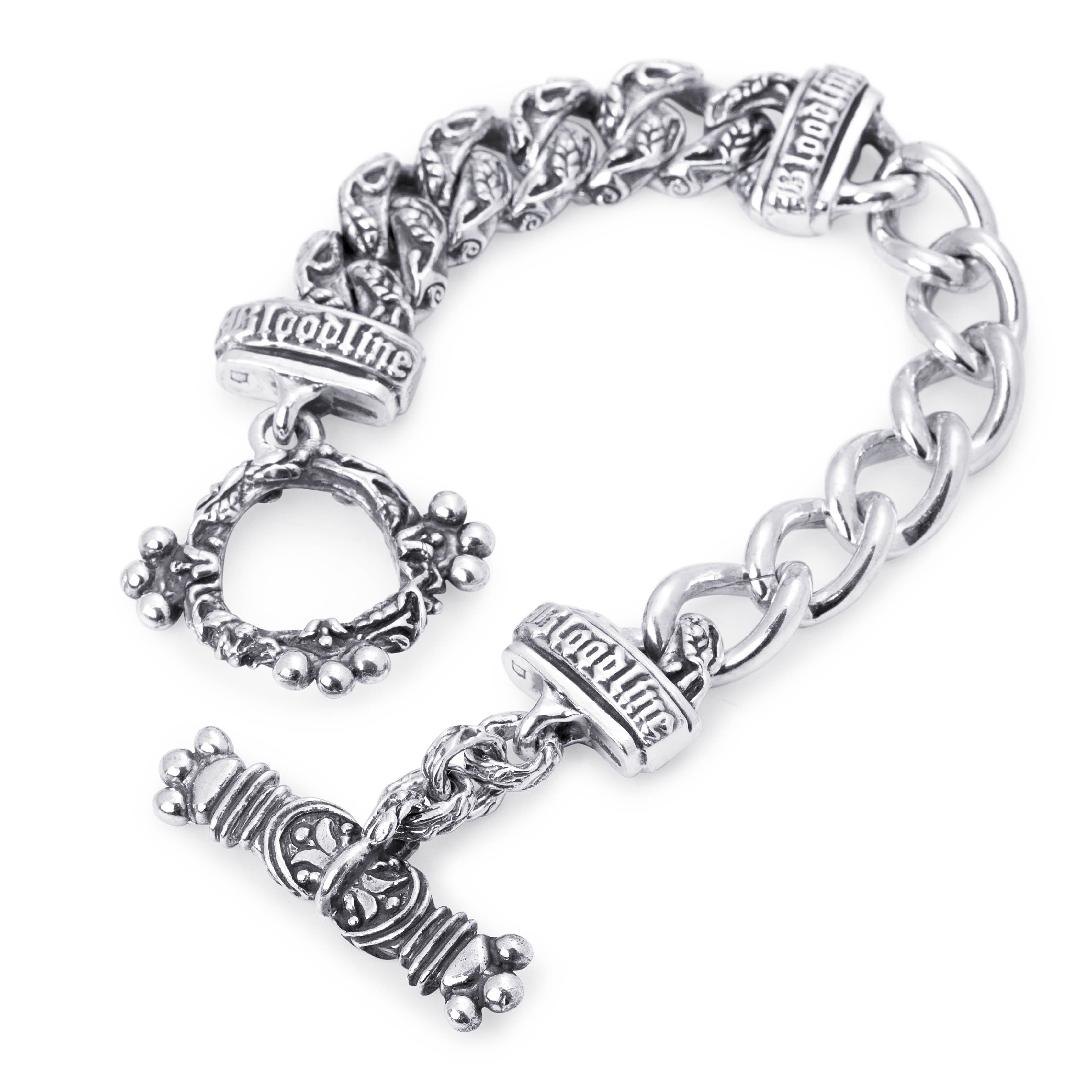 Angled view of the Half and Half silver bracelet showing contrasting curb links, Bloodline lettering and an ornate toggle clasp.