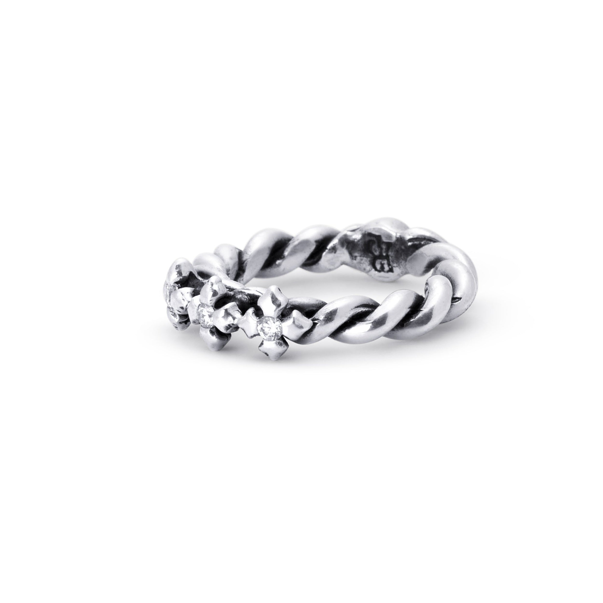 A sterling silver twisted rope ring with small clear gemstones set along the front, photographed on a clean white background.