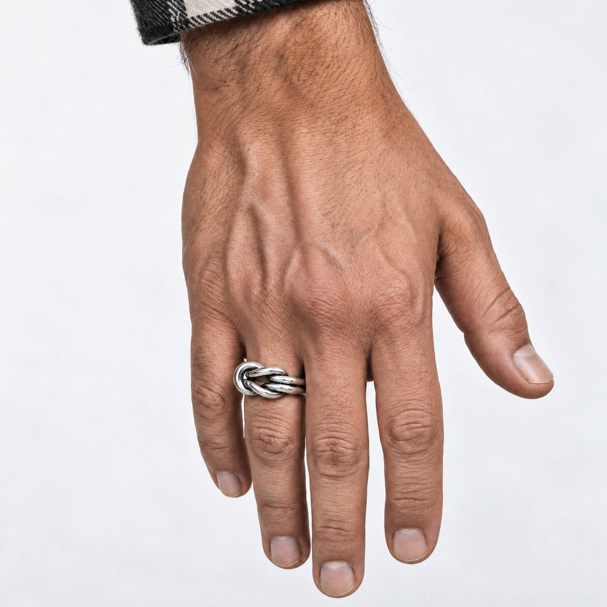 Nautical Knot sterling silver ring worn on a model’s hand, showing the interwoven knot design and polished finish.