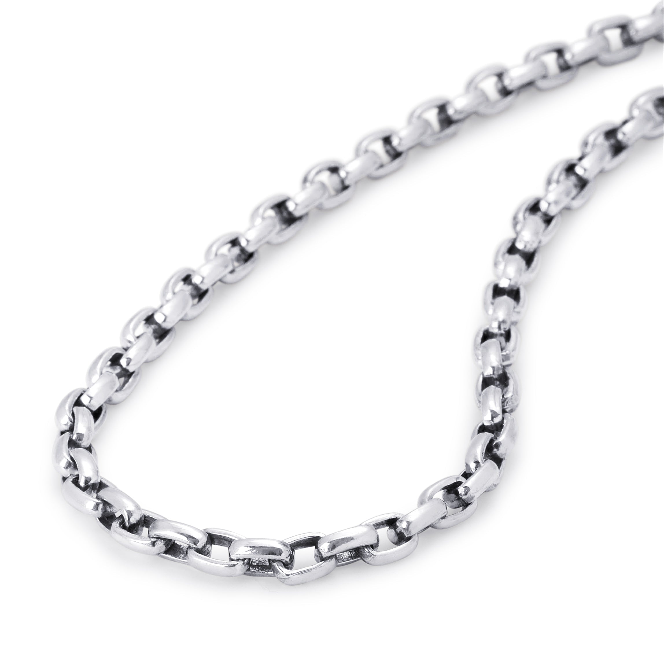 A close-up of a polished silver-tone metal chain necklace with a classic curb link design, arranged in a loop on a clean white background.