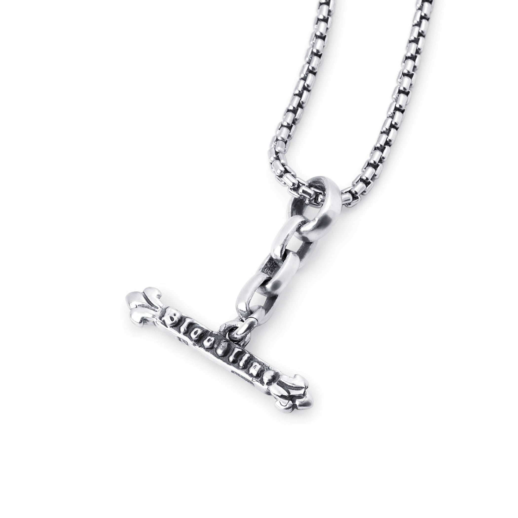 A silver-toned necklace featuring a small cross pendant with the word 'BLOODLINE' engraved on it, suspended from a box chain against a plain white background.