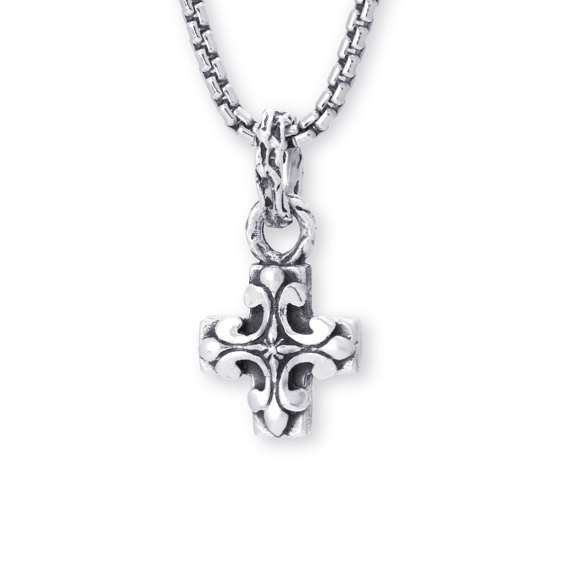 A silver cross pendant necklace with an ornate, textured filigree design, suspended from a matching silver box chain against a plain white background.