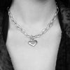 A model wearing our Solid Sterling Silver Classic Heart Pendant with Journey etched on the face