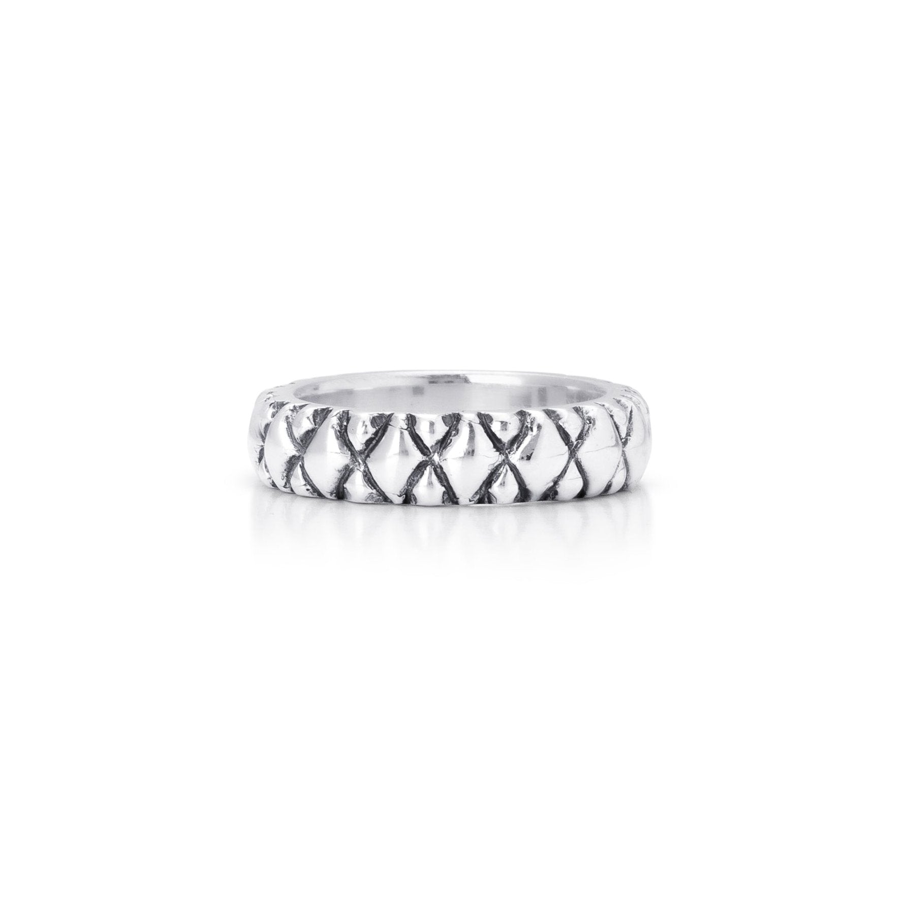 Solid Sterling silver band with carved quilted detailing.