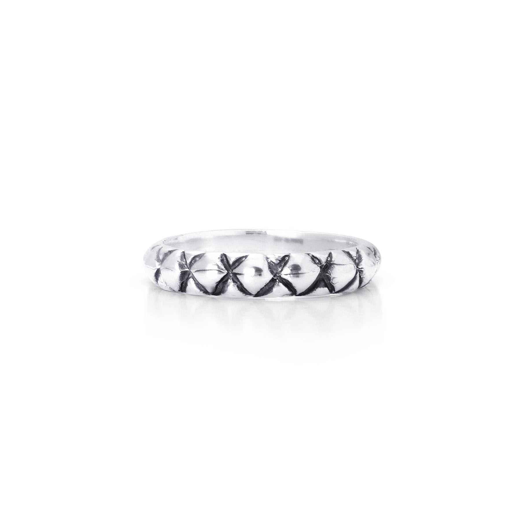 Solid Sterling silver band with carved quilted detailing.