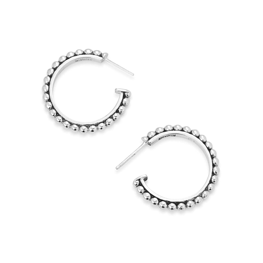 Large solid sterling silver with bead patterned on a circular hoop stud.