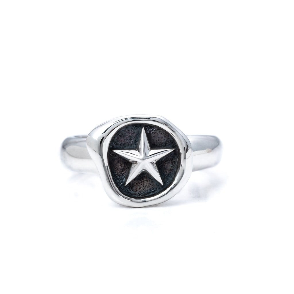 Solid Sterling Silver ring, wax stamp head on the ring with a star revealed. Front view