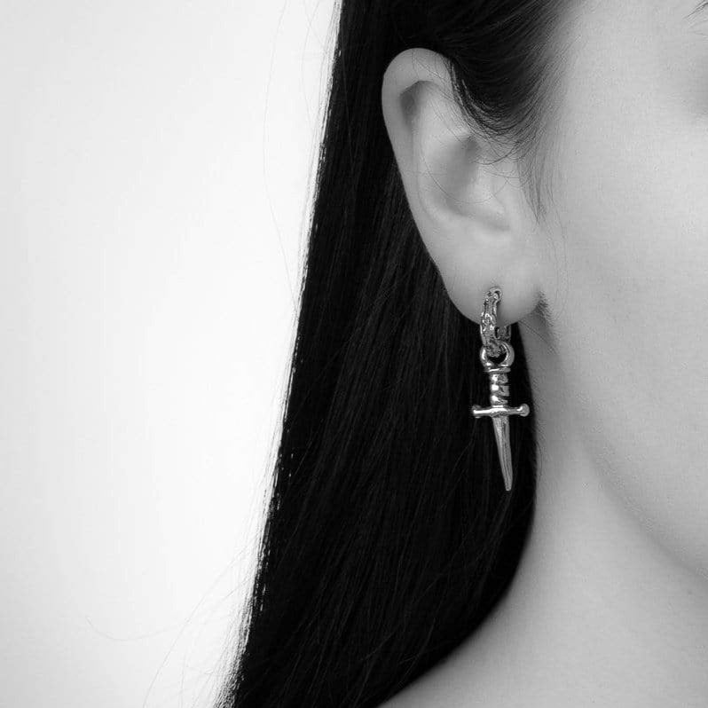 Model Photo Bloodline Design Unisex Eternal Vine Hoop Earrings With Daggers on a model.