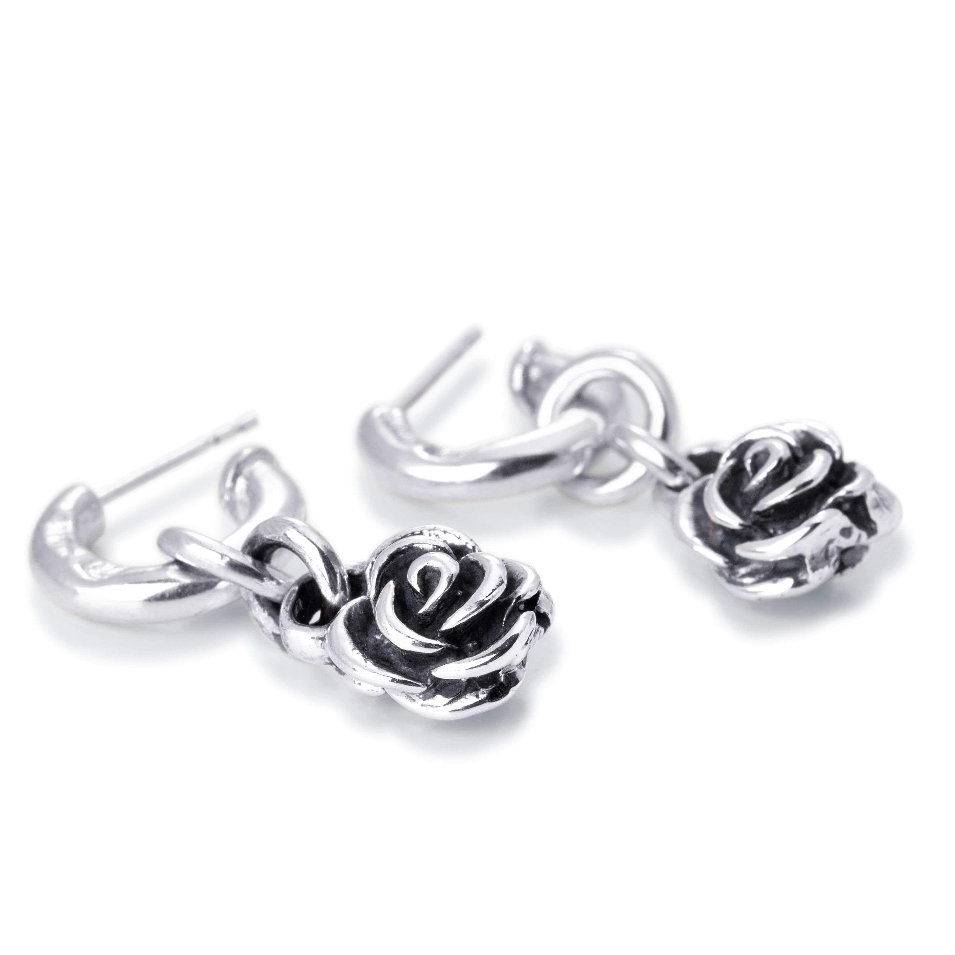 Plain solid sterling silver hoop stud with hanging rose charm.