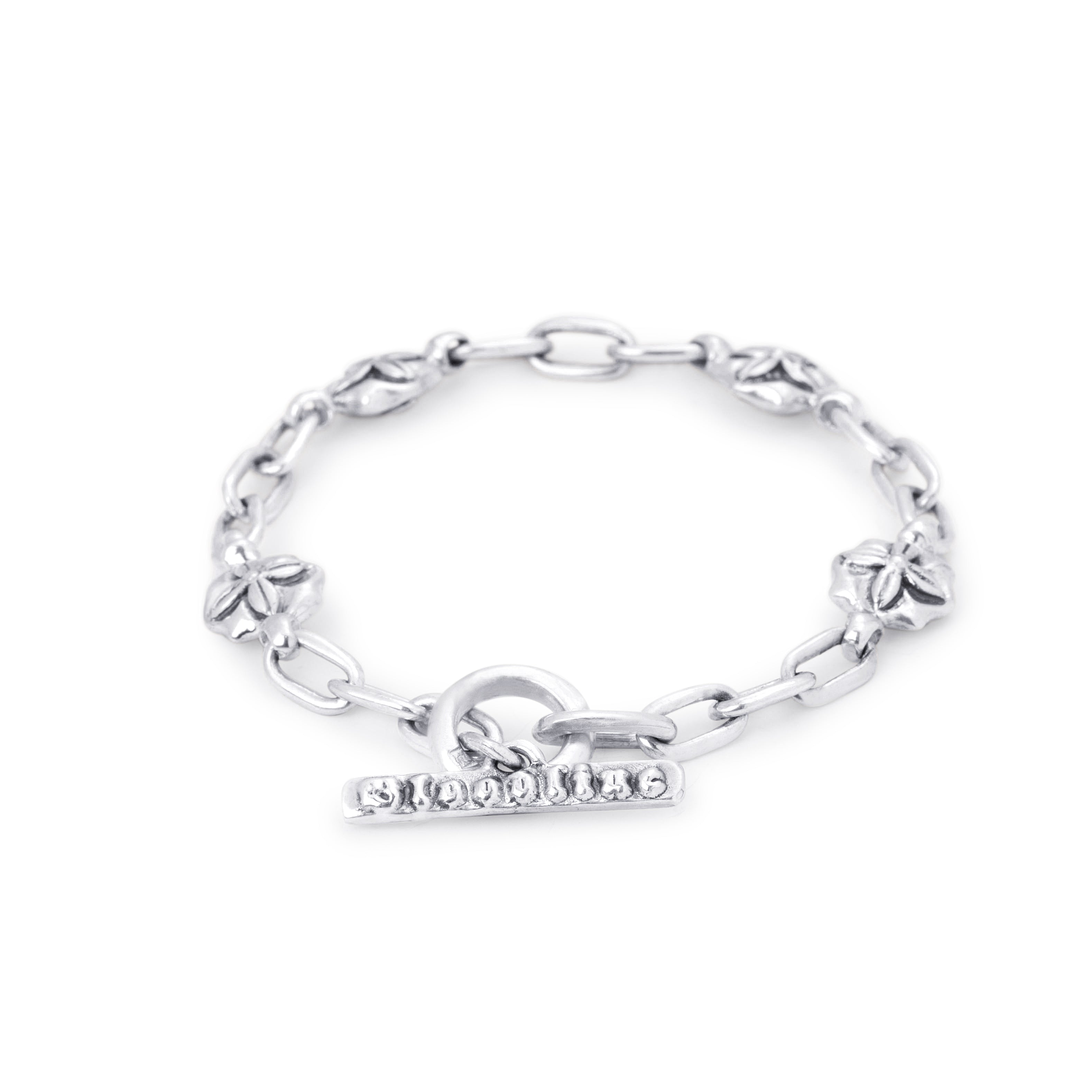 A silver chain bracelet featuring four small flower charms and a toggle clasp engraved with the word 'SOPHIA', displayed on a clean white background.