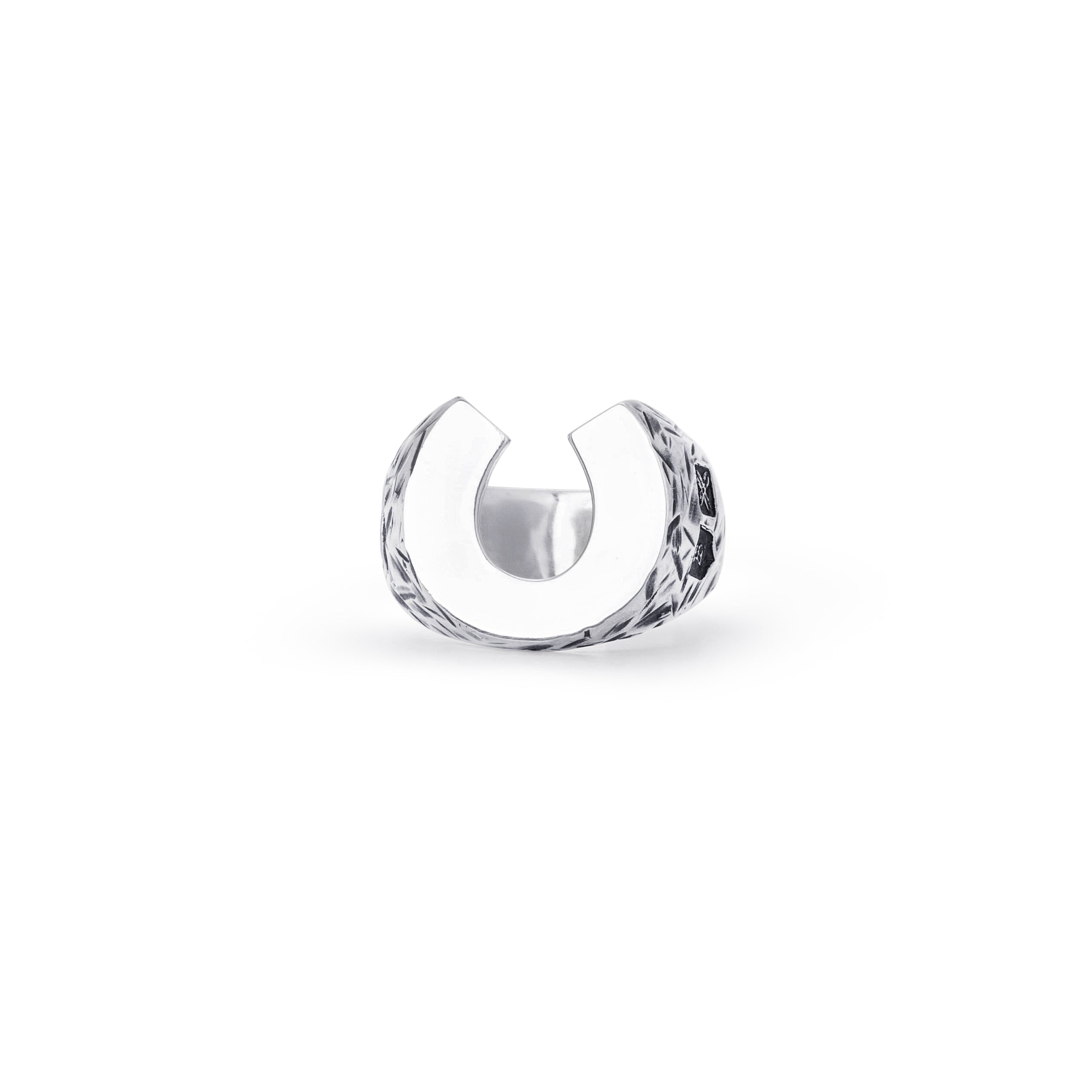 A sterling silver Horseshoe ring againstv a white background. 