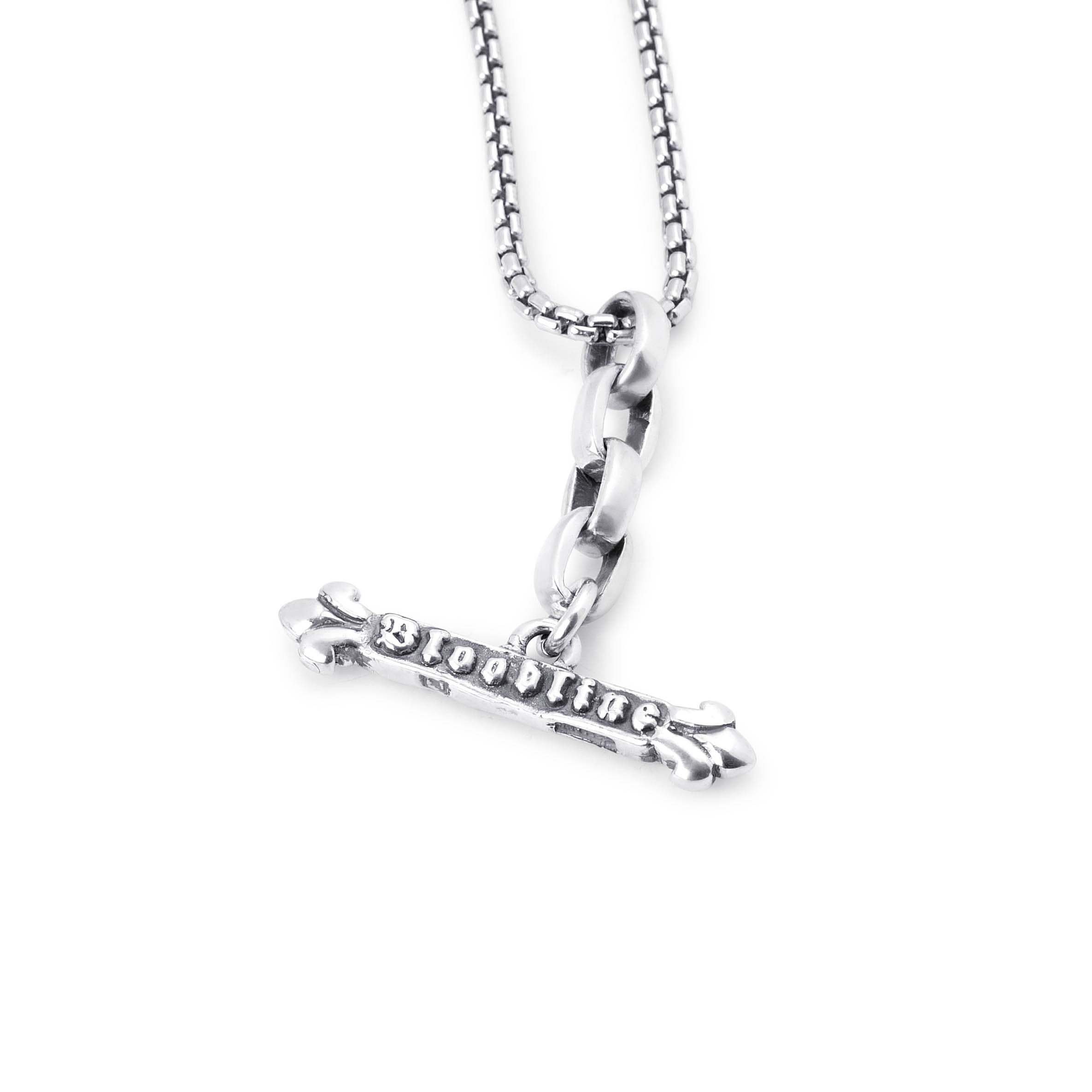 A silver-tone necklace featuring a horizontal pendant engraved with the word 'BLOODLINE' in a raised gothic font, suspended from a box chain on a plain white background.