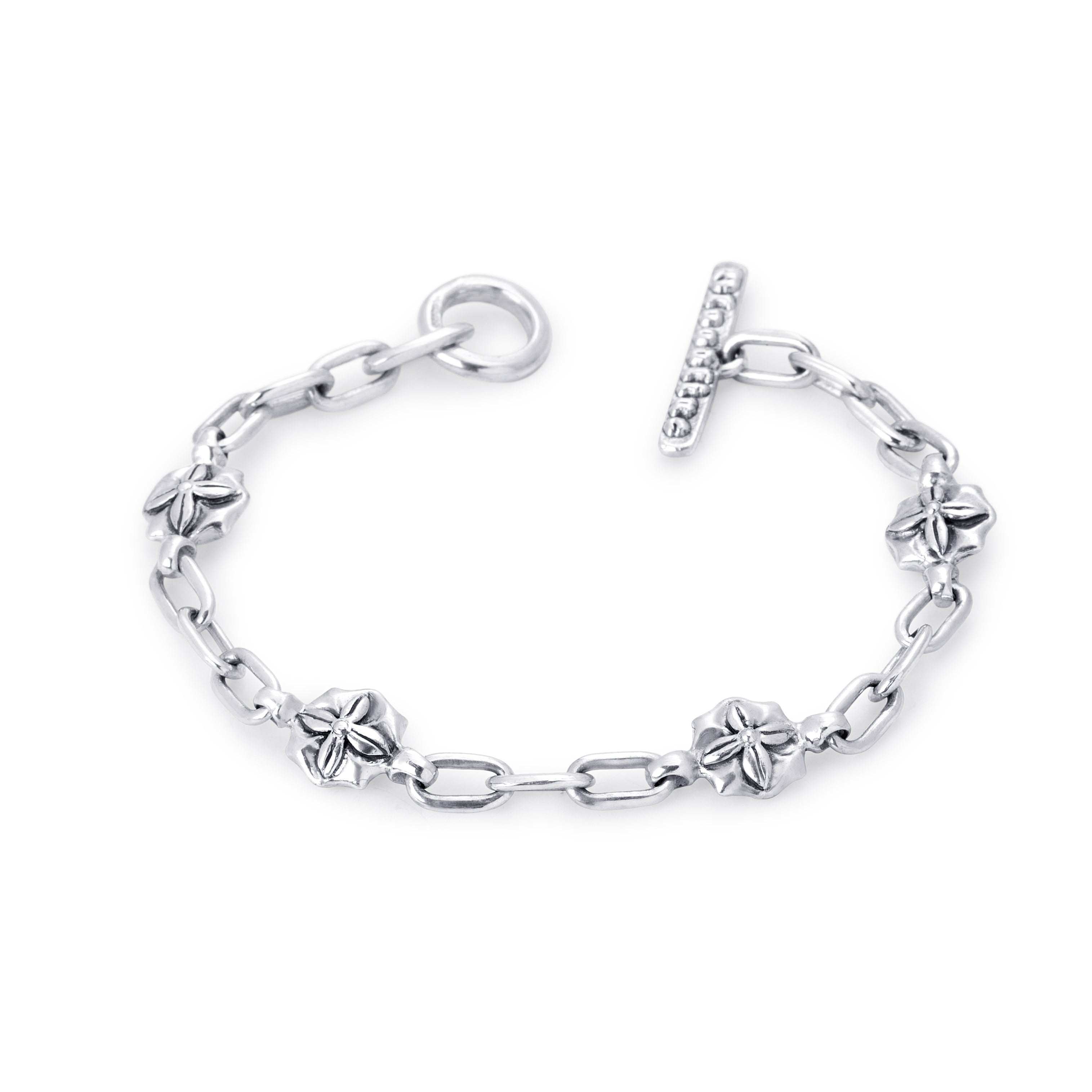 A sterling silver toggle clasp chain bracelet featuring alternating textured starburst flower links and classic oval links, displayed on a clean white background.
