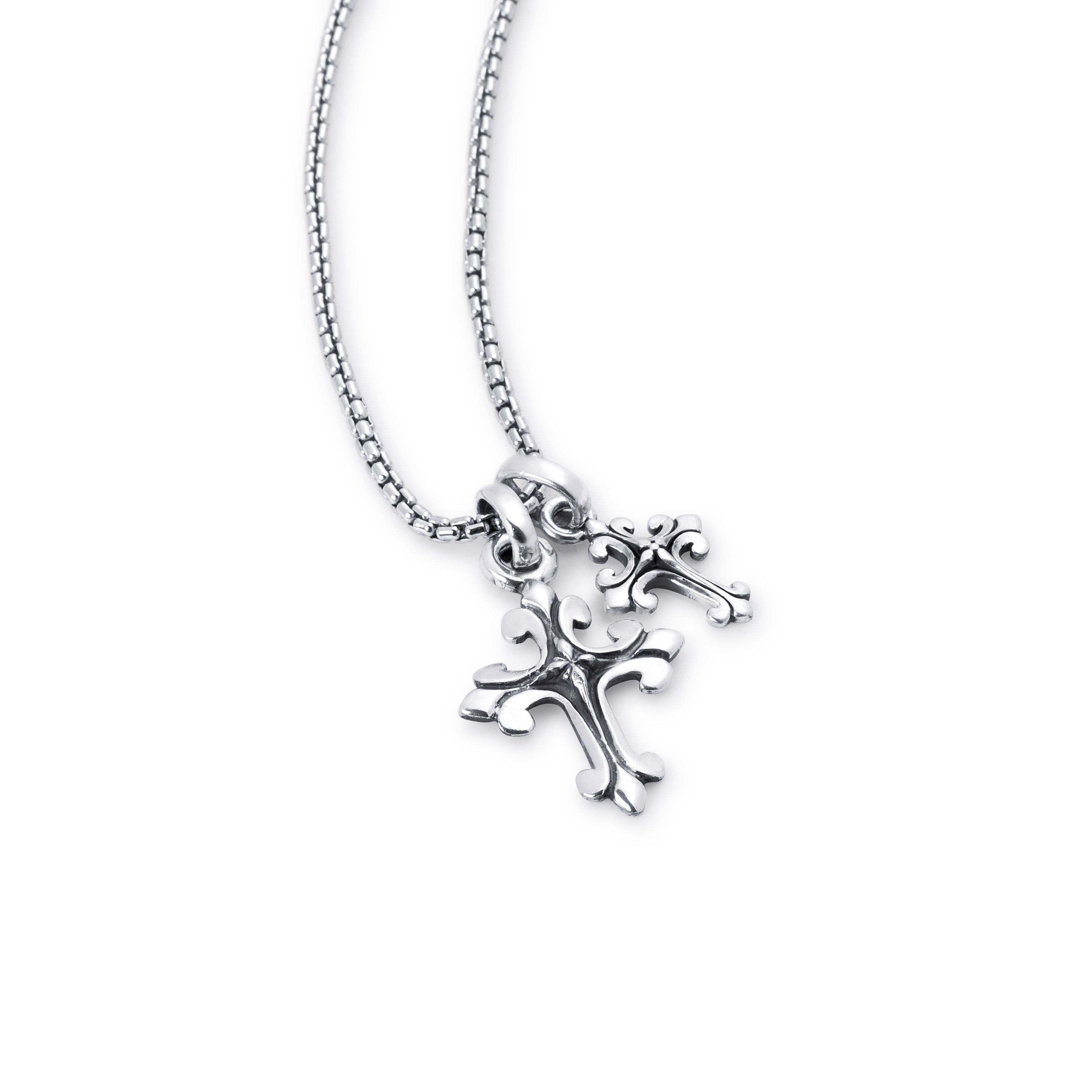 A silver cross pendant necklace with a textured, ornate design hanging from a silver beaded chain, shown against a plain white background.