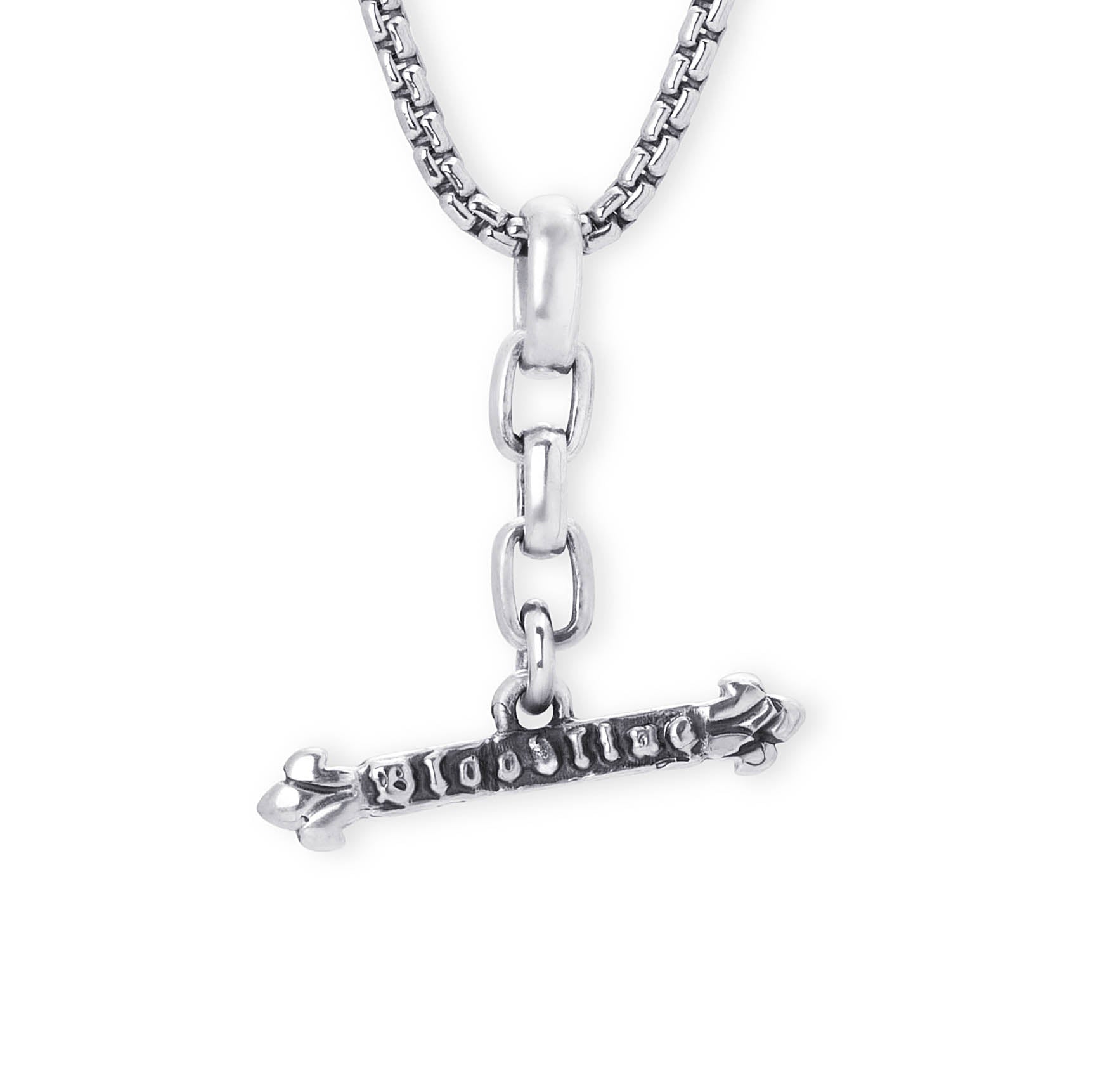 A silver-toned metal pendant necklace featuring a horizontal bar engraved with the word 'BLOODLINE' and decorative claw-like ends, suspended from a box chain on a plain white background.