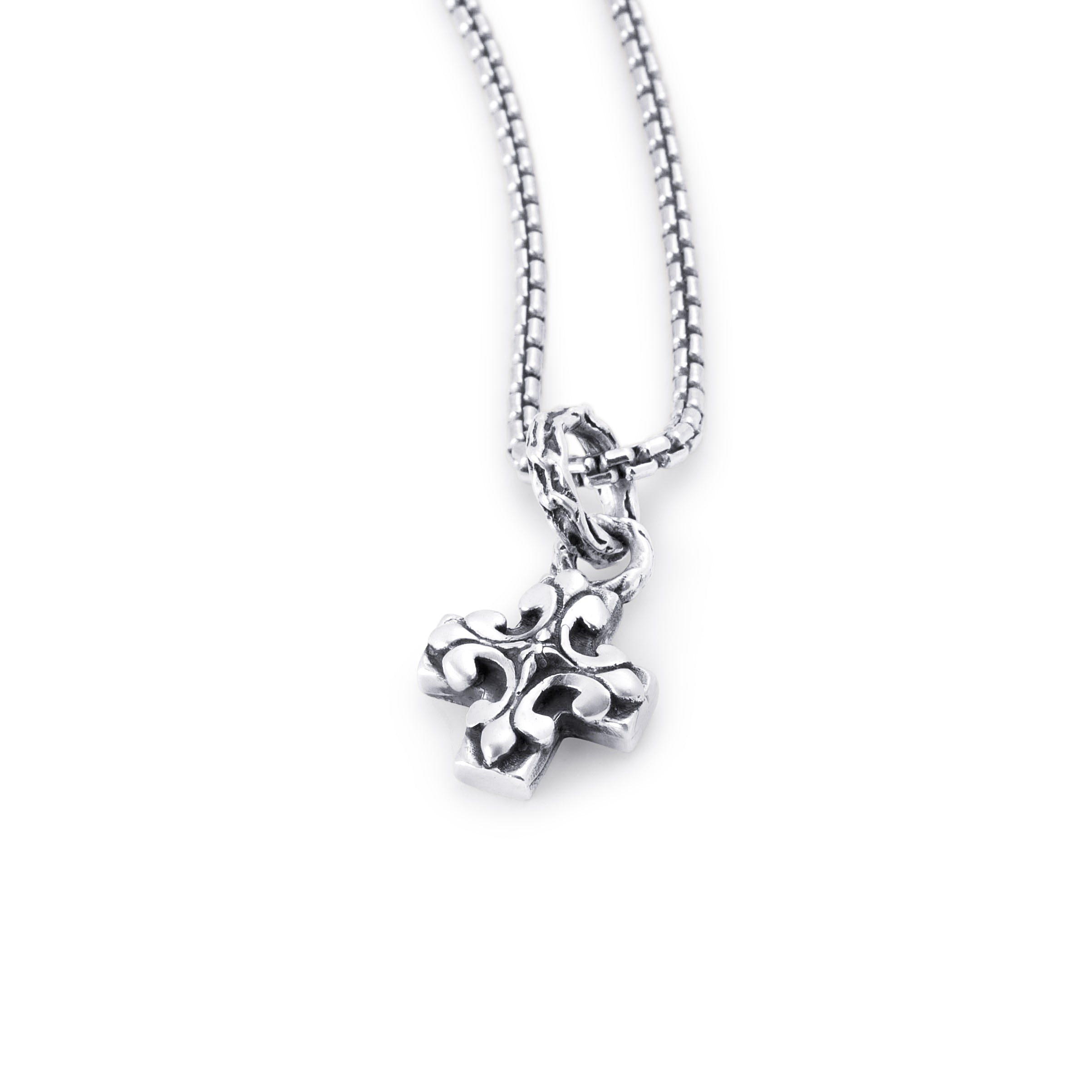 A silver cross pendant necklace with a textured, oxidized design hanging from a silver box chain against a plain white background.