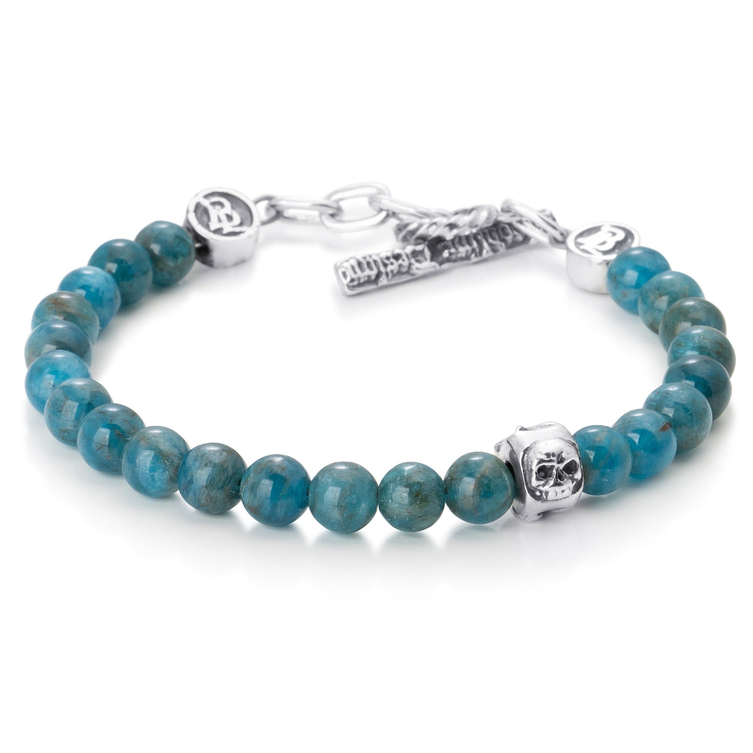  Apatite Beads paired with a single sterling silver bead engraved with a heart star and skull on a stainless steel cable with Sterling silver T clasp.