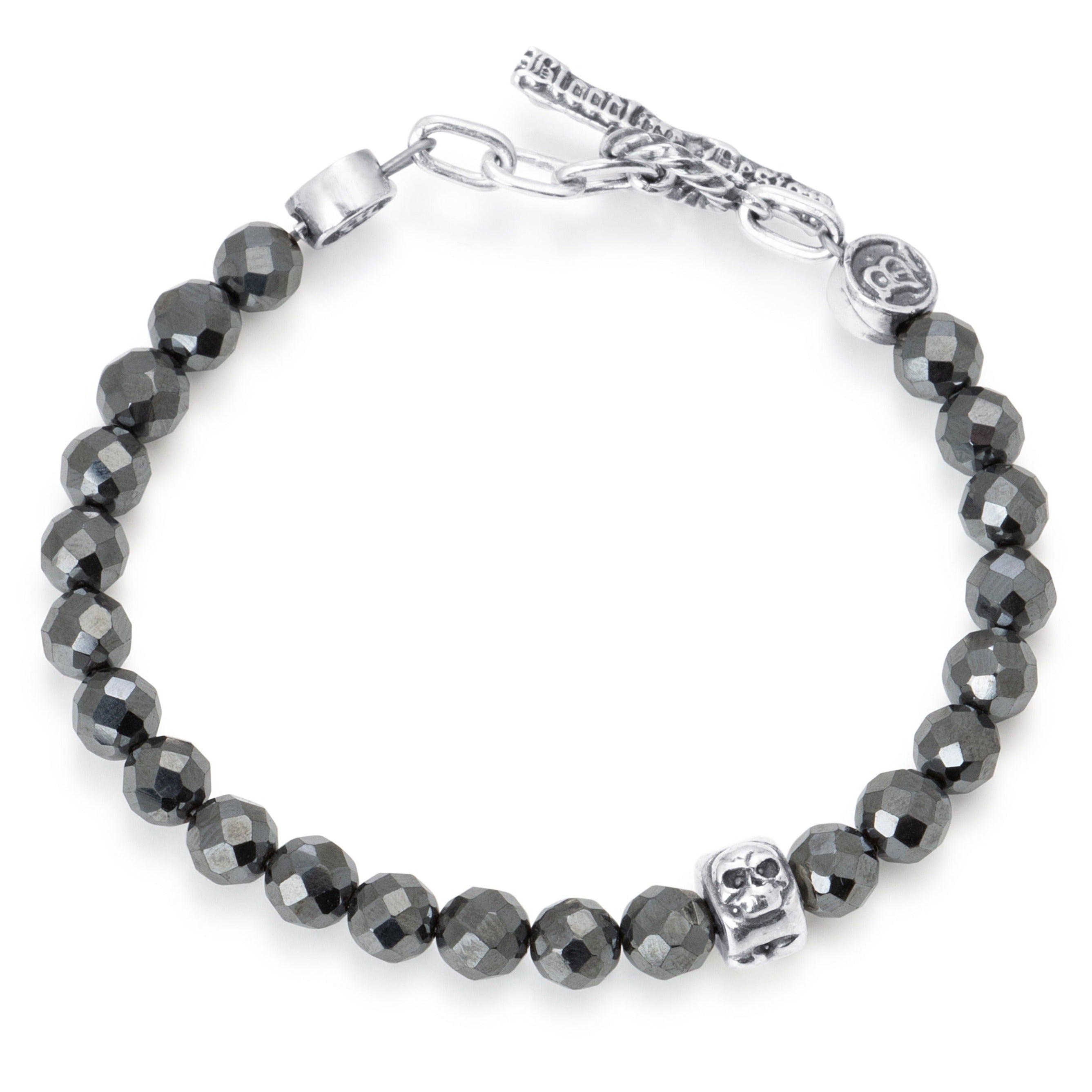 Facetted Hematite beads paired with a single sterling silver bead engraved with a heart star and skull on a stainless steel cable with Sterling silver T clasp.