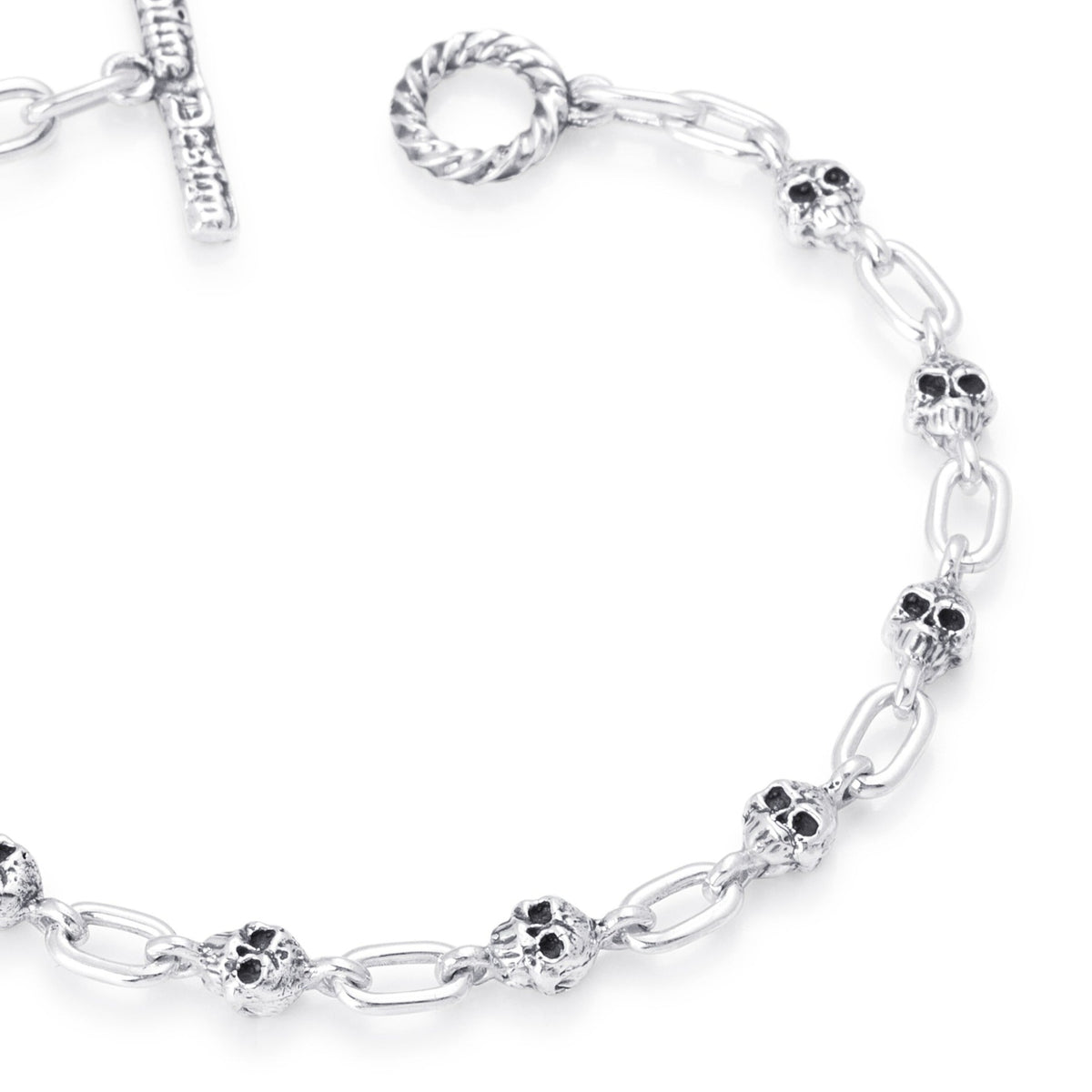 Close-up sterling silver Small Skull Link chain bracelet handmade in Vancouver