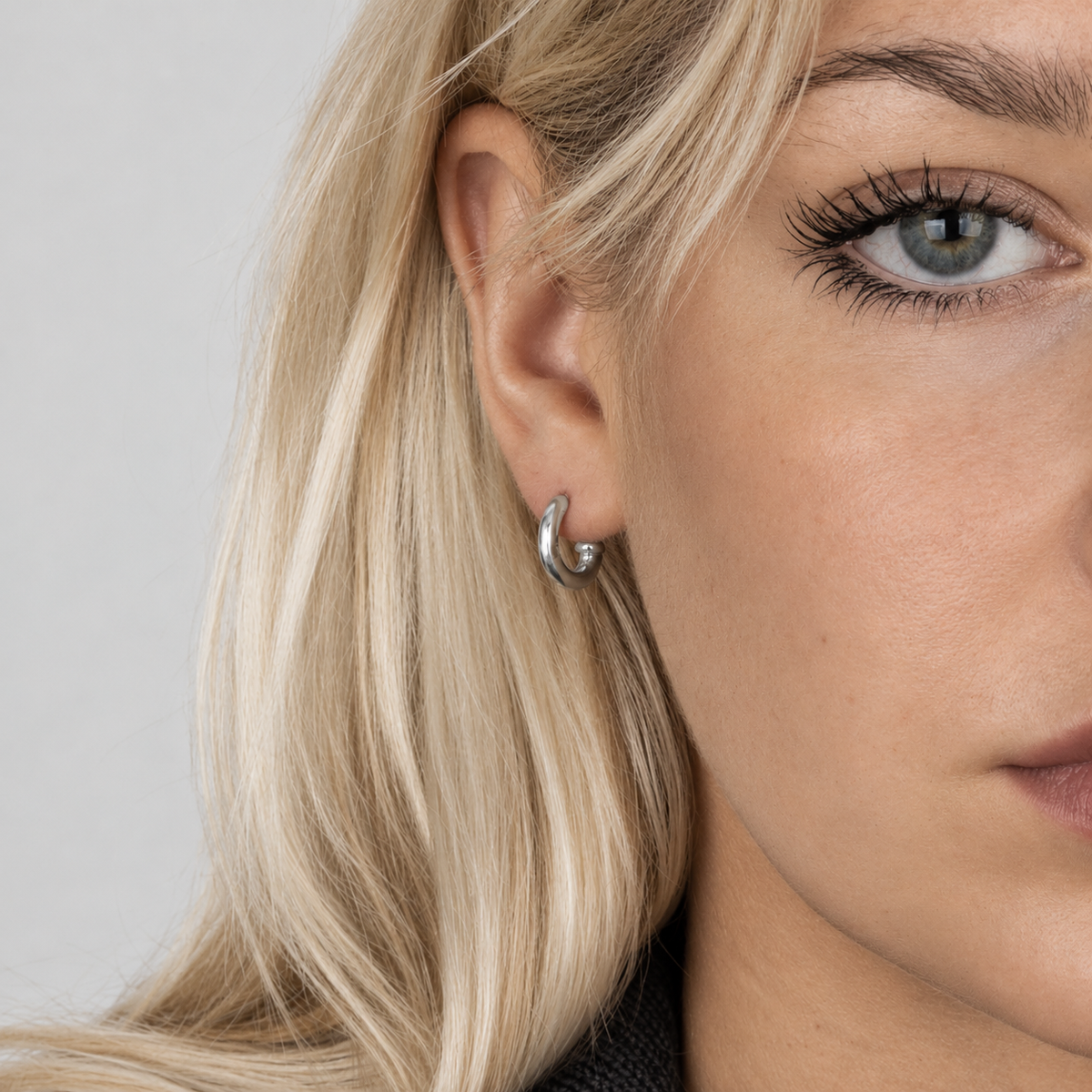 hallmark hoop sterling silver earrings worn on ear - Bloodline Design