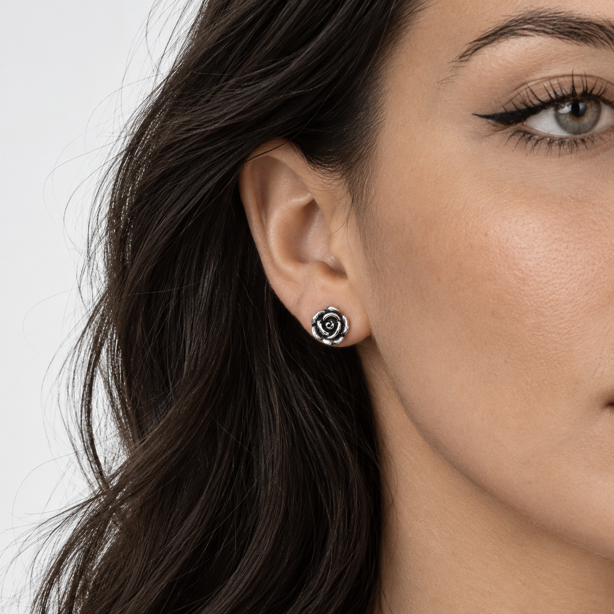 Rose Stud Sterling Silver earrings worn on ear - Bloodline Design