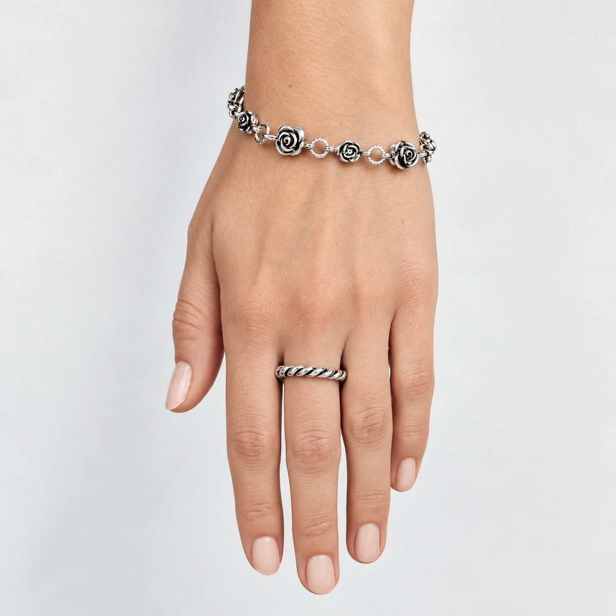 women's small twisted rope ring worn on finger