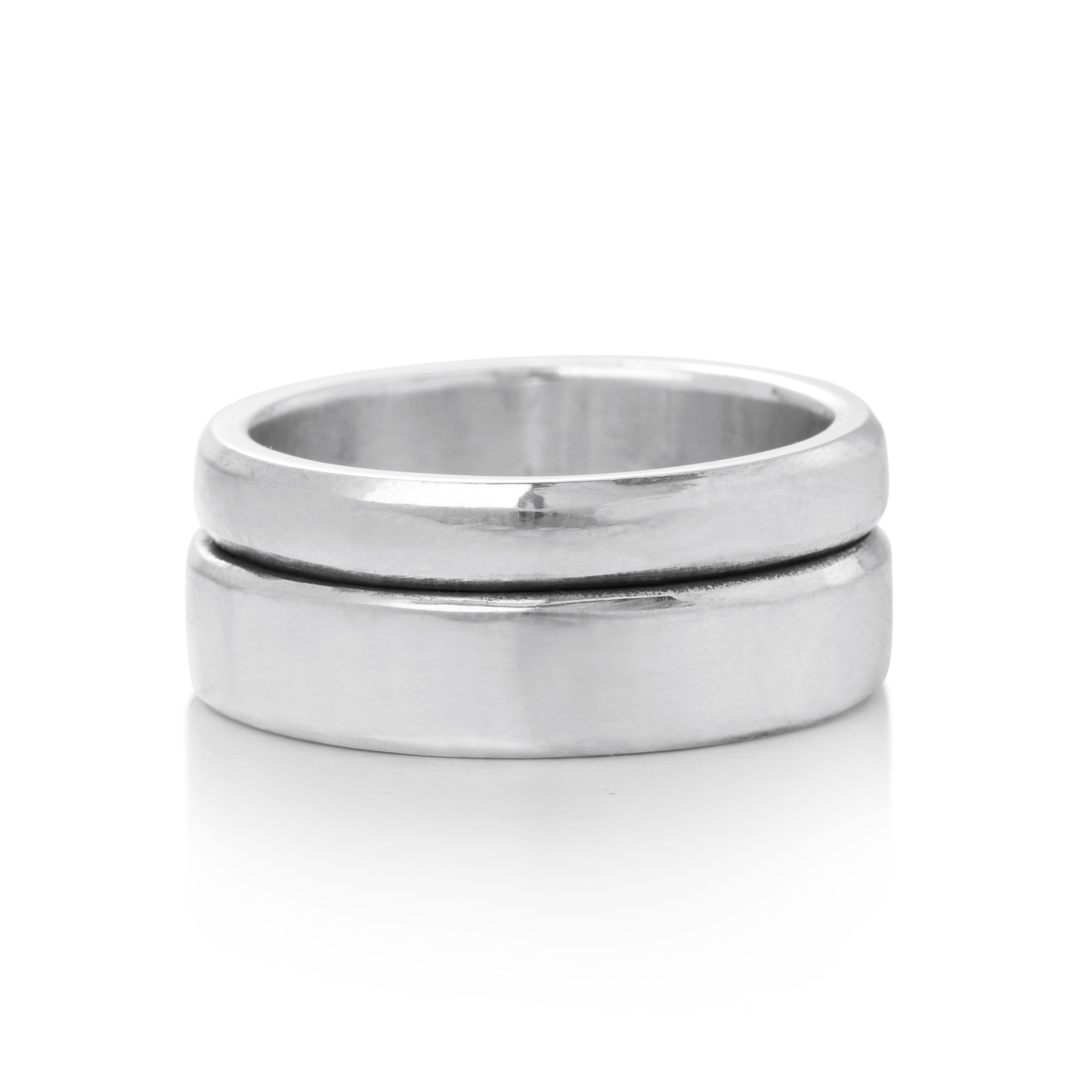 Solid Sterling Silver bands appearing to be fused together creating a large stacked ring band