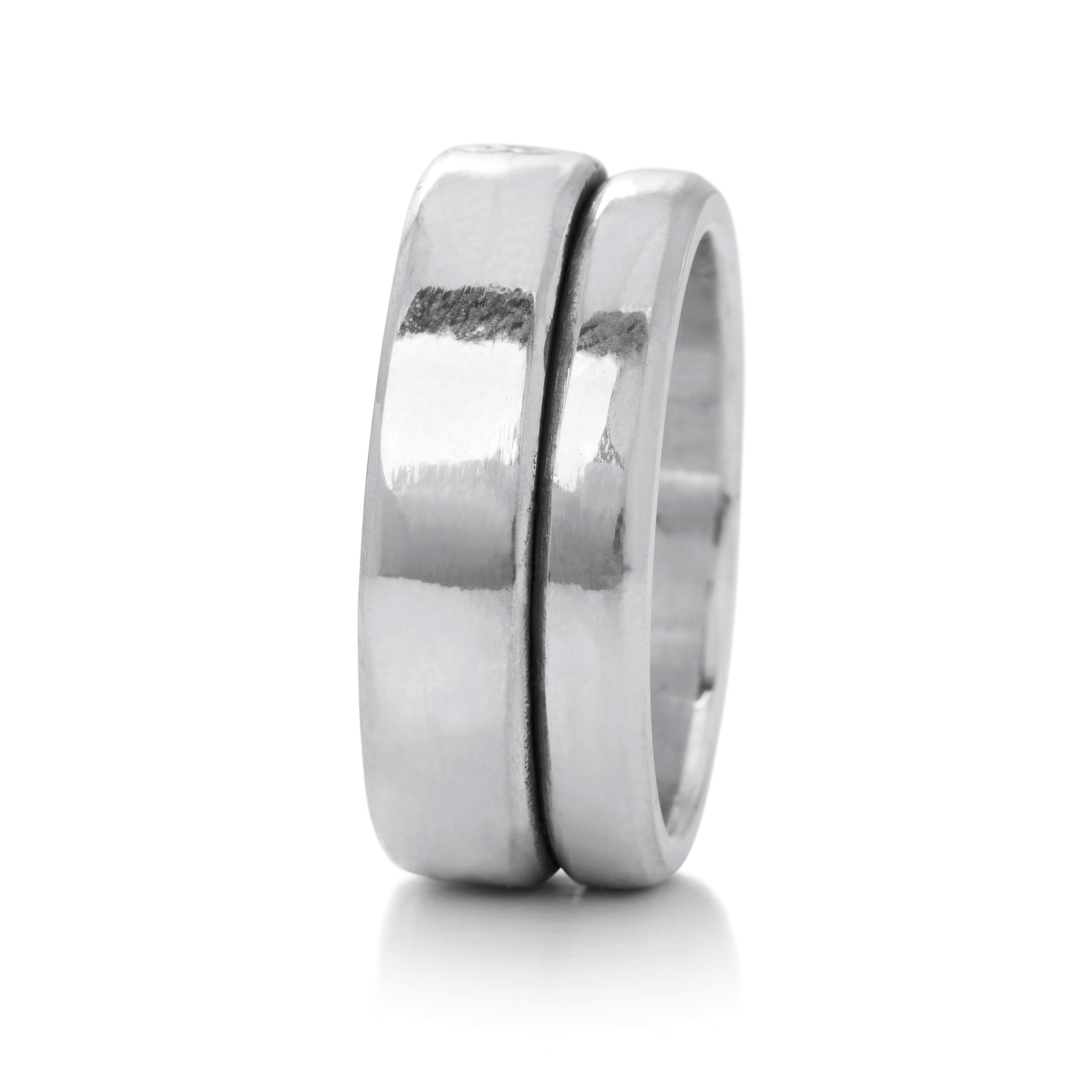 Solid Sterling Silver bands appearing to be fused together creating a large stacked ring band