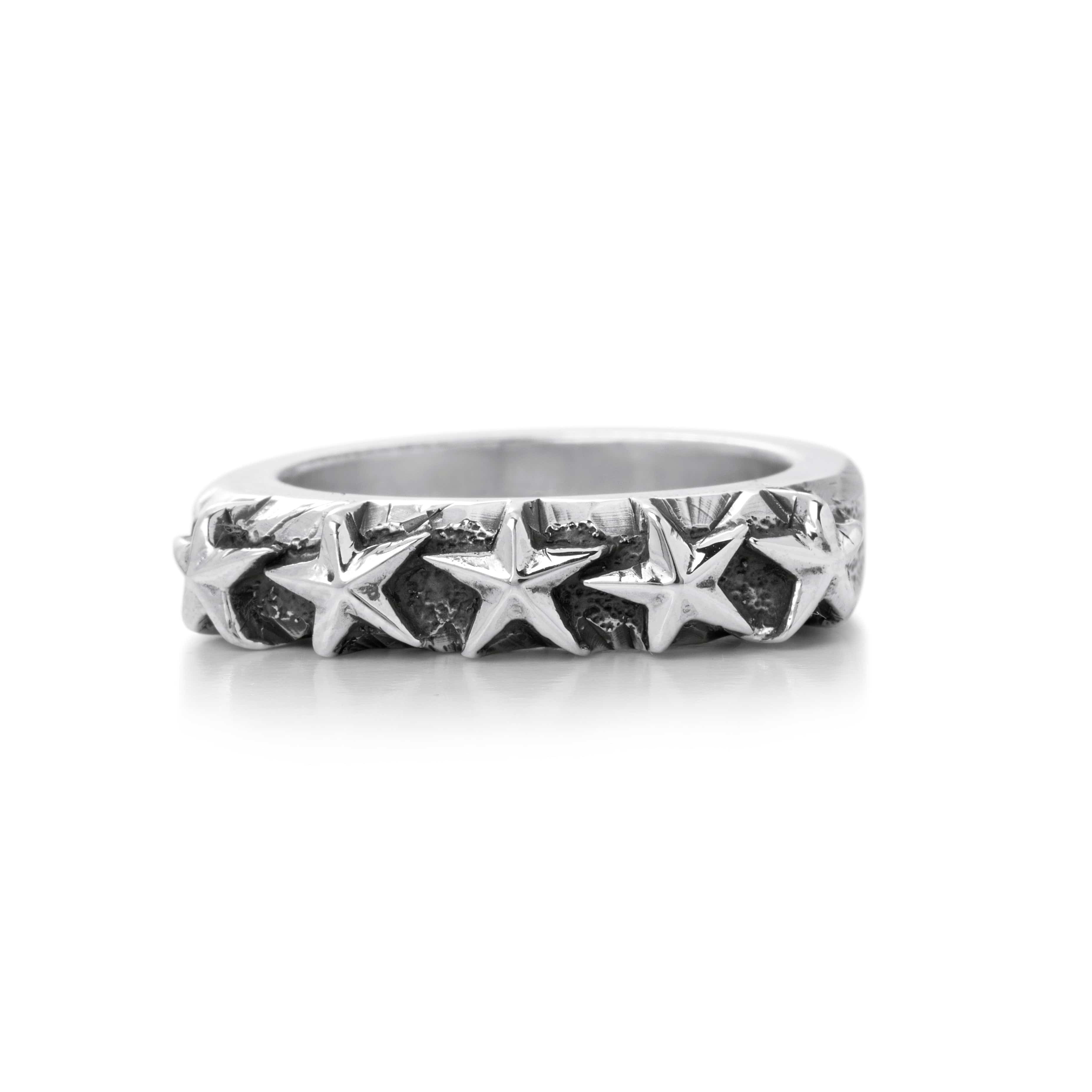Solid Sterling Silver band decorated with five stars on the top of the ring, blackening surrounds the stars