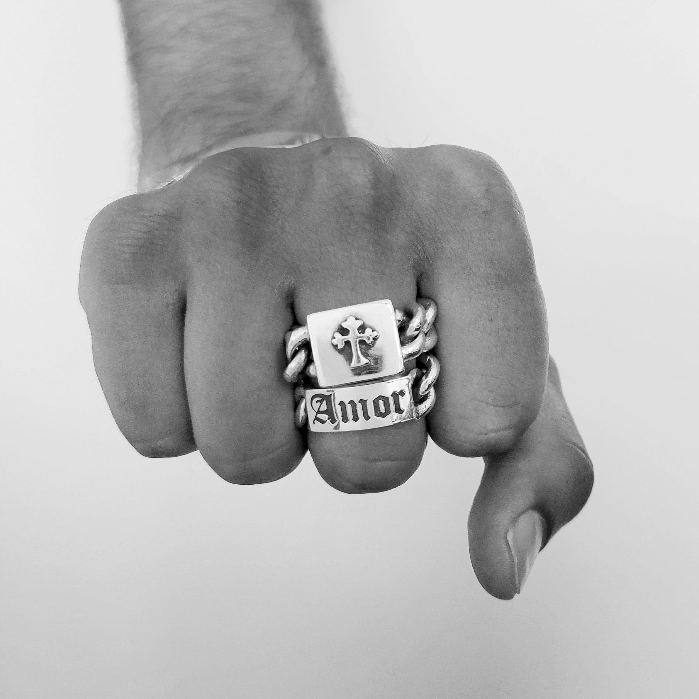 Solid Sterling Silver chain link ring, the head of the ring is a solid box with a cross design atop. On a male models hand