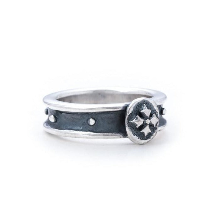 Solid Sterling silver Ring, a concave band with Floret Coin at the top
