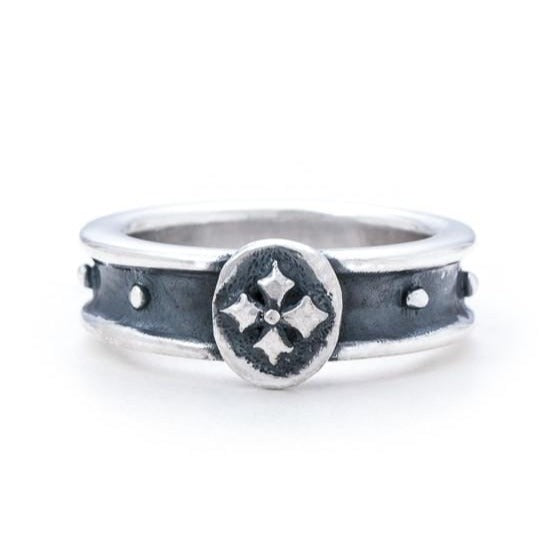 Solid Sterling silver Ring, a concave band with Floret Coin at the top