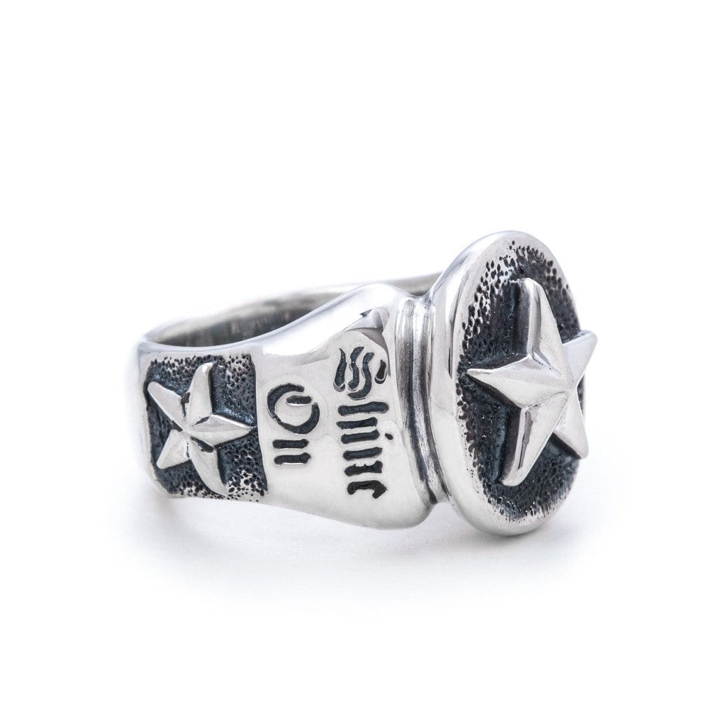 Solid Sterling Silver thick band, one star on the side of the ring and a larger star on the head of the ring. The words 