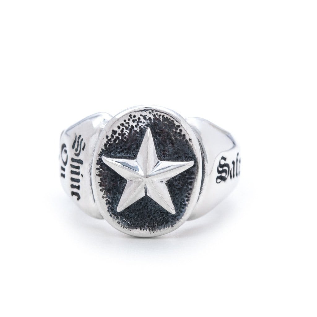 Solid Sterling Silver thick band, one star on the side of the ring and a larger star on the head of the ring. Front view 